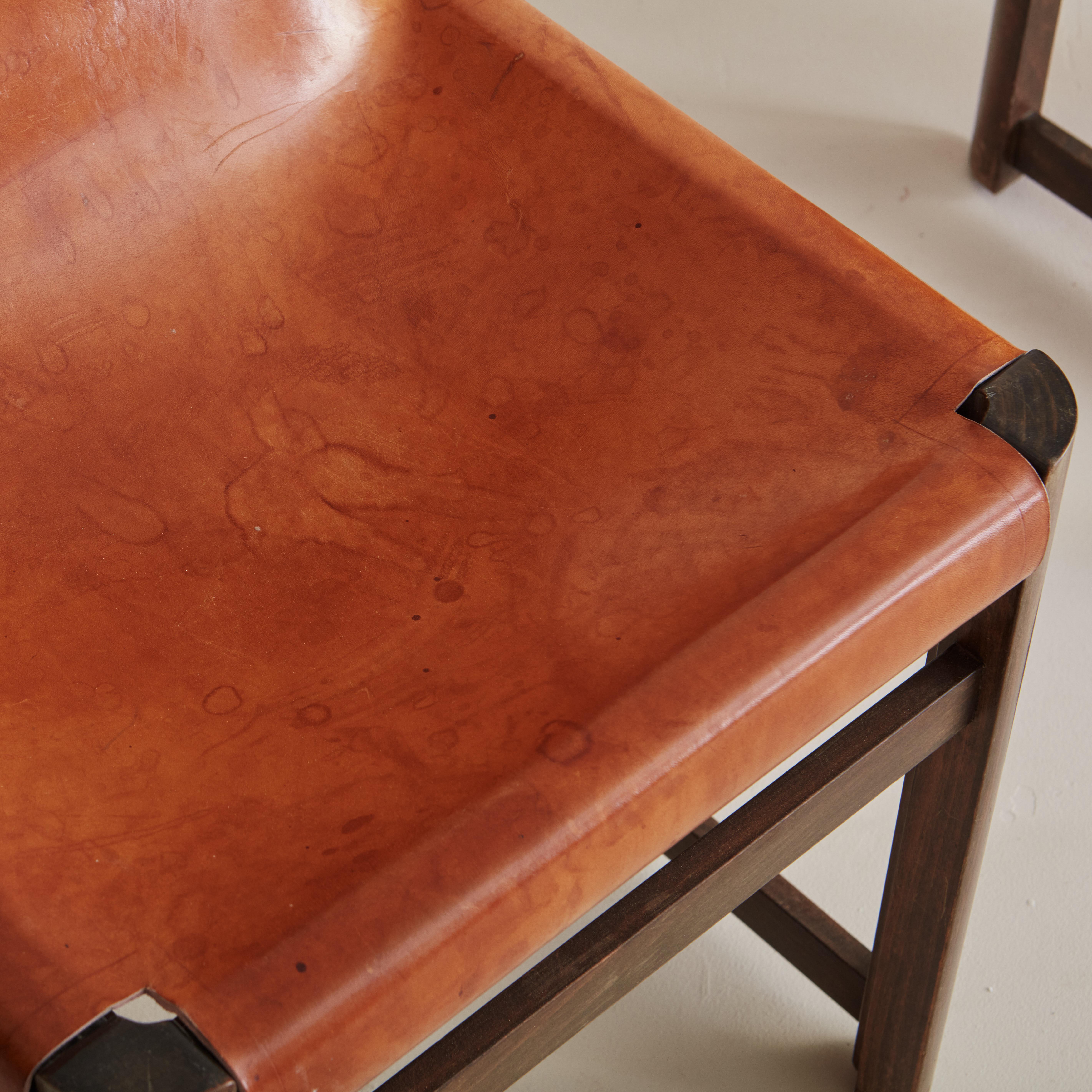 Set of 7 Saddle Leather Sling Back Dining Chairs by Jordi Vilanova In Good Condition In Chicago, IL