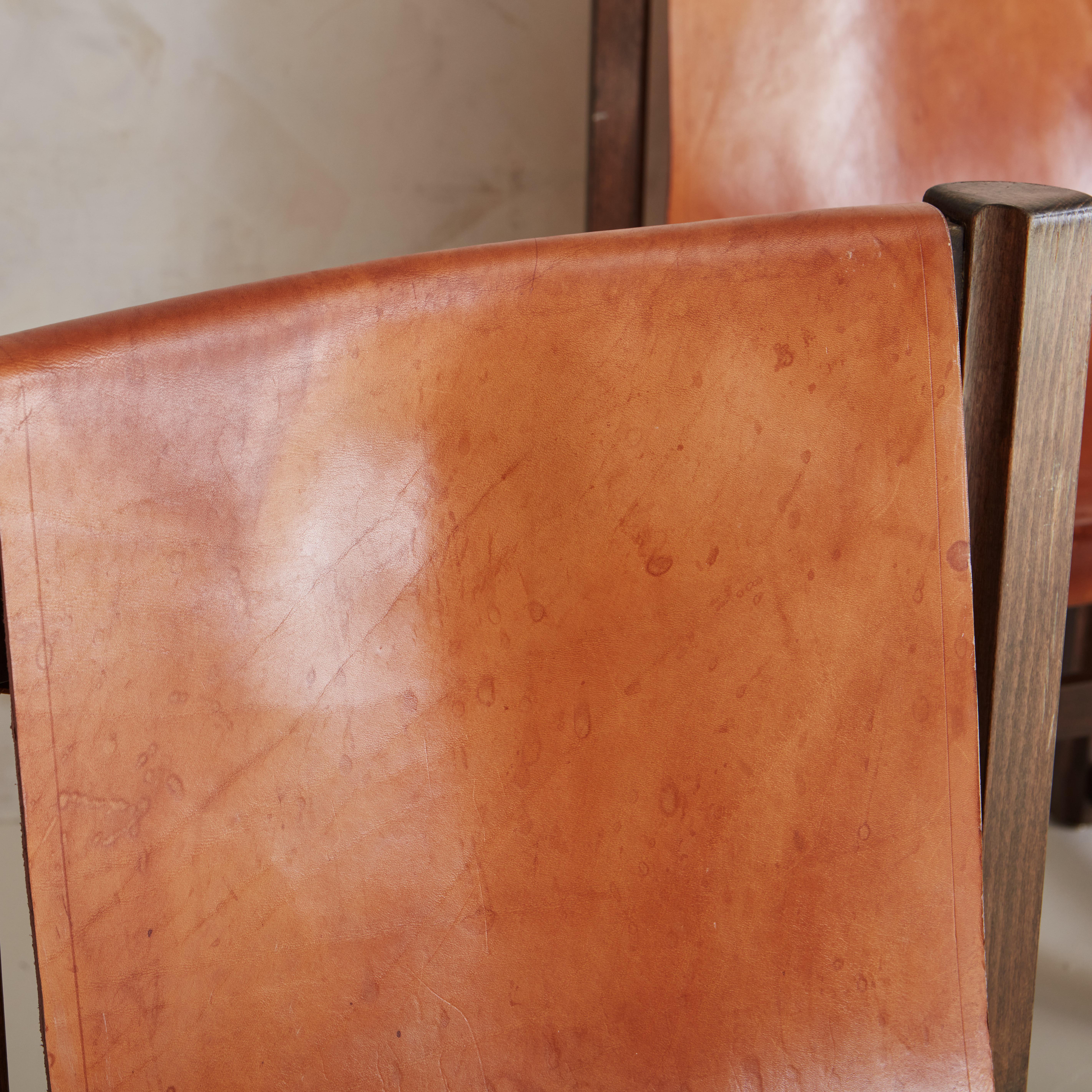 20th Century Set of 7 Saddle Leather Sling Back Dining Chairs by Jordi Vilanova