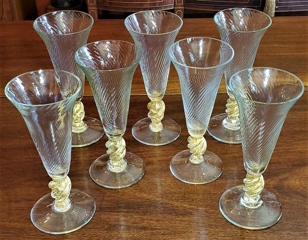 Presenting a gorgeous set of 7 Salviati Venetian gold fleck tall champagne flutes.

Made in Venice, Italy circa 1960 by the World famous Salviati Glassworks.

In near mint condition with no chips or cracks.

Each consists of a clear glass