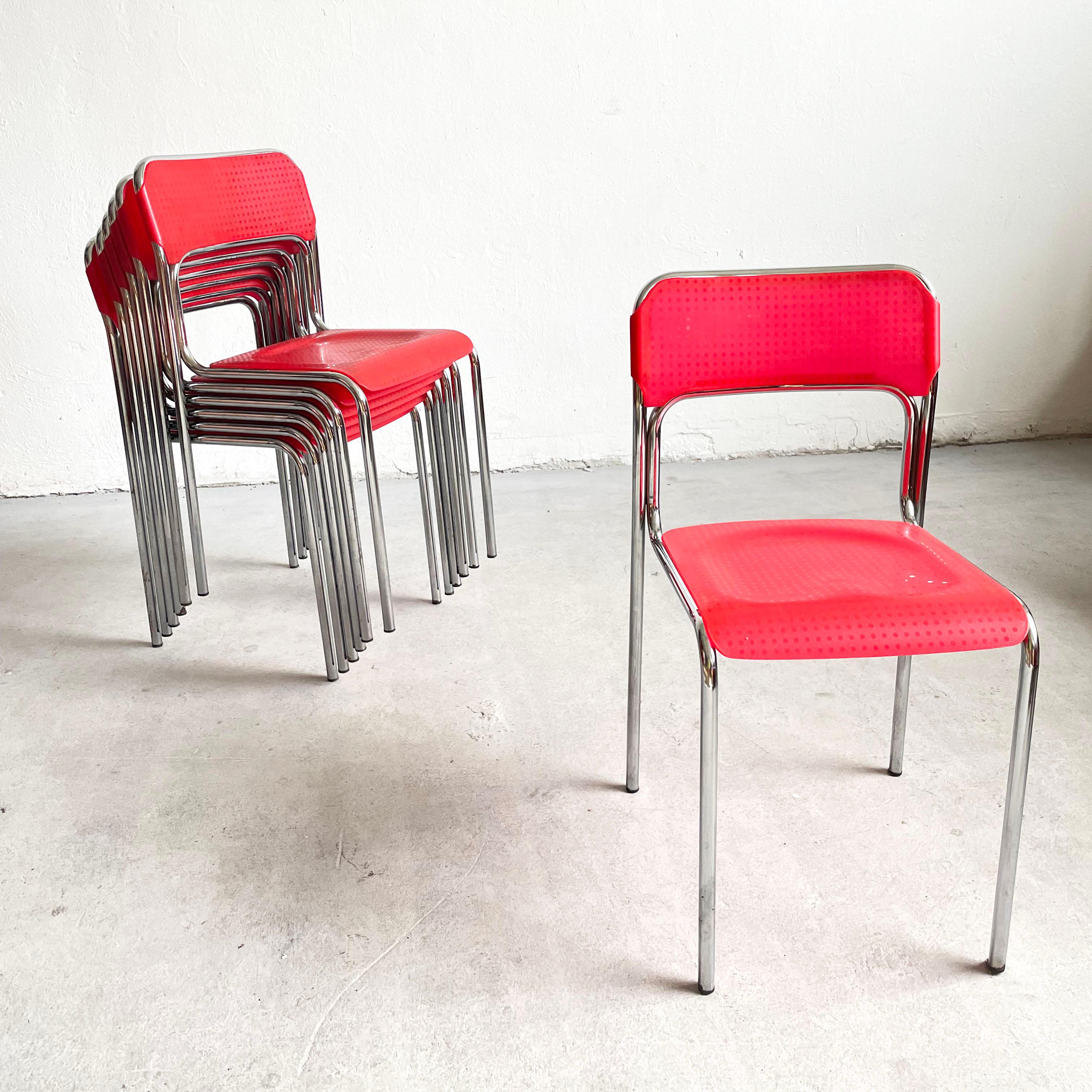 Set of 7 stacking bauhaus style Italian dining chairs (7th chair is a bonus)

The chairs were produced between 1970s and 1980s

The chairs feature sturdy tubular chrome frame and red plastic seat and backrest.

The chairs are in a very good vintage