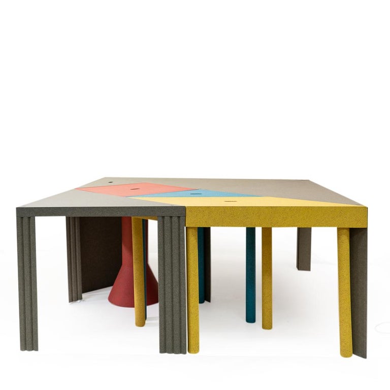 Set of seven modular tables from the Tangram series designed by Massimo Morozzi for Cassina during the early 1980s.

This colorful table is based on the old Chinese puzzle game Tangram, allowing the user to create endless layout variations only
