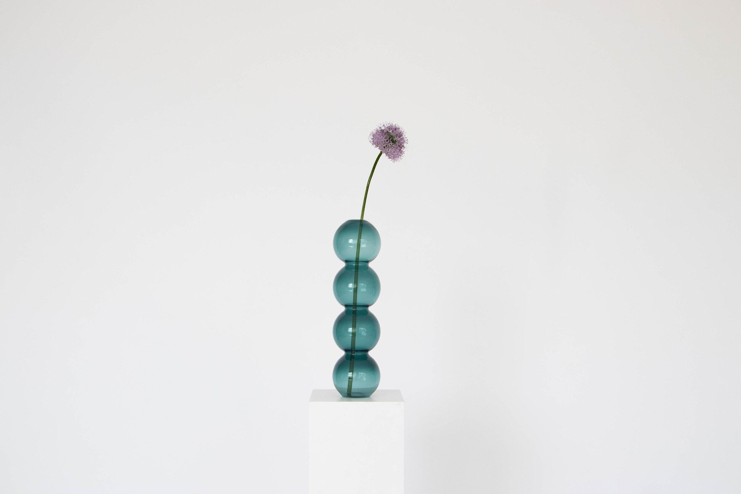 A set of 7 Teal bubble vase by Valeria Vasi
Handmade in Barcelona, 2021
Materials: glass
Dimensions: 38 x 10 cm
Also available in: clear, pink, blue. 

A sculptural vase entirely crafted in Barcelona by a skillful local artisan using a glass