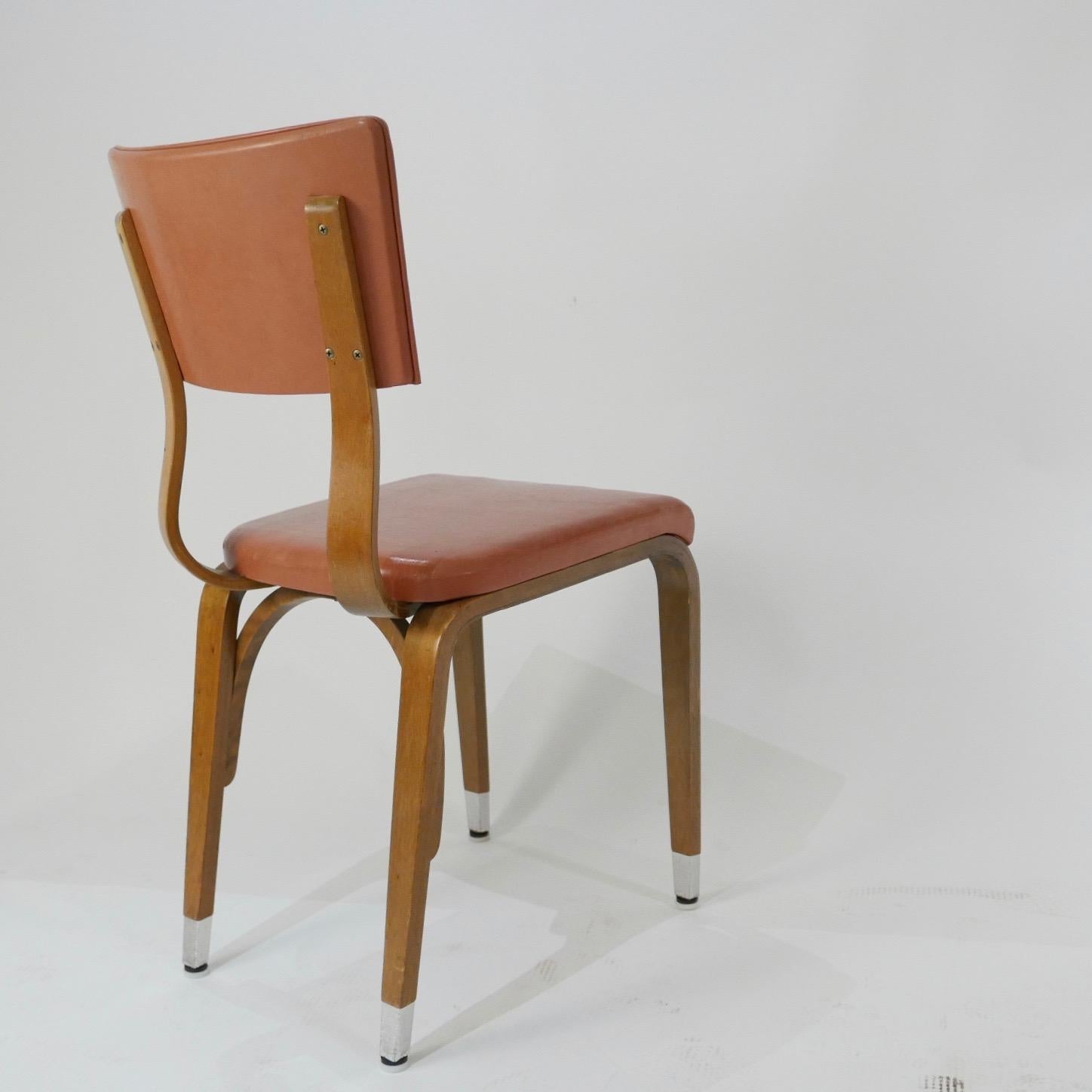 All chairs are sturdy and in good solid condition. These chairs would be great for a restaurant or cafe'. Solid bent plywood frames with a light terracotta colored seat and back. Very usable and versatile classic design that would mix well with