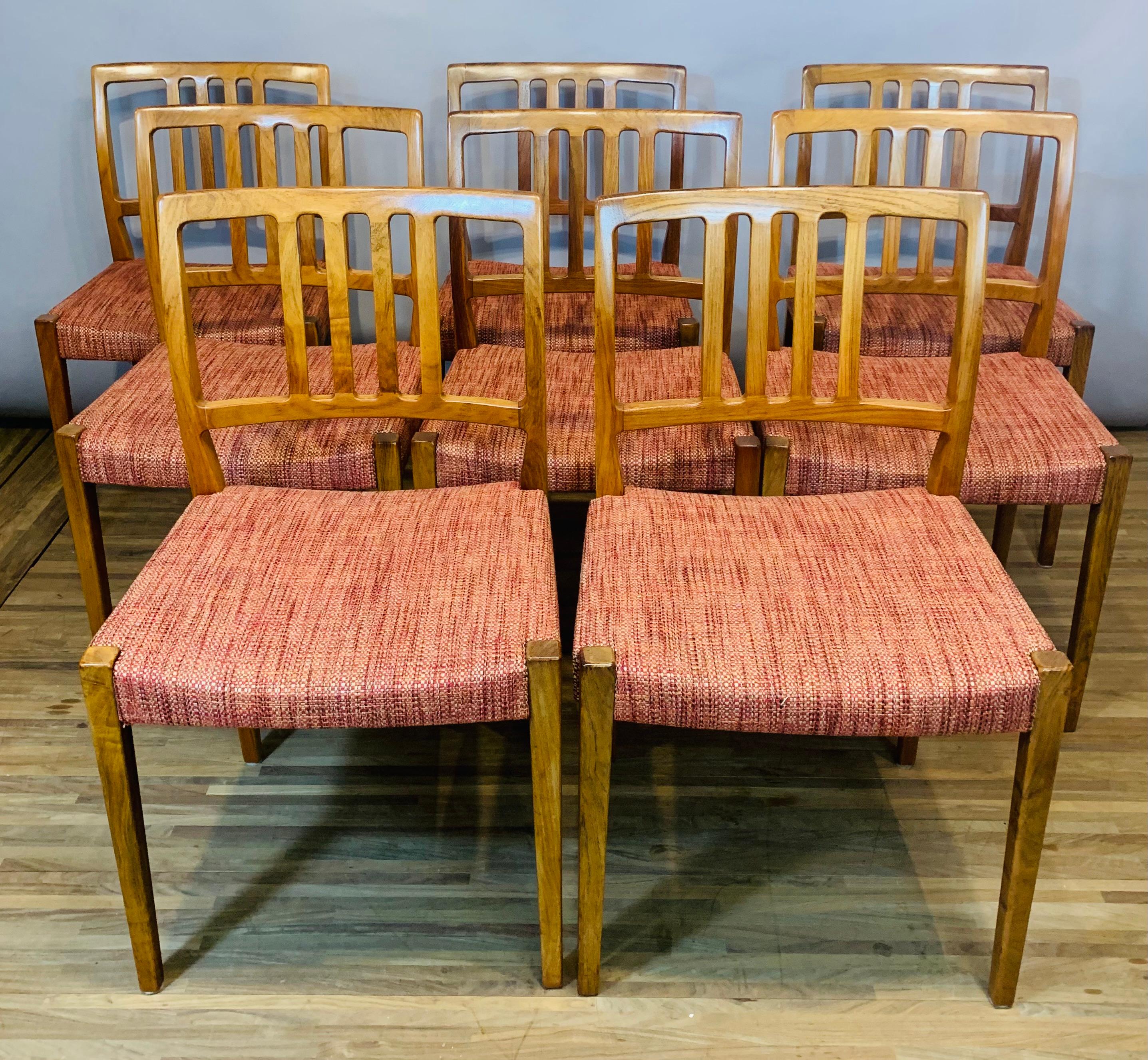 A very desirable and well-made set of 8 Rosewood mid-century dining chairs. Manufactured in Denmark during the 1960s by Dyrlund. These rare to source dining chairs have been restored and feature an eye-catching colourful fabric on each of their
