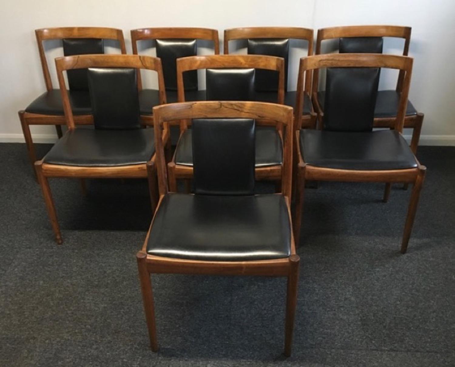 A rare set of 8 Danish leather and rosewood dining chairs designed by Architect Kai Kristiansen in the 1960s.  The chairs are from the 'Univers' series from 1965.  A beautiful and classic design and said to be the best design from the many years he