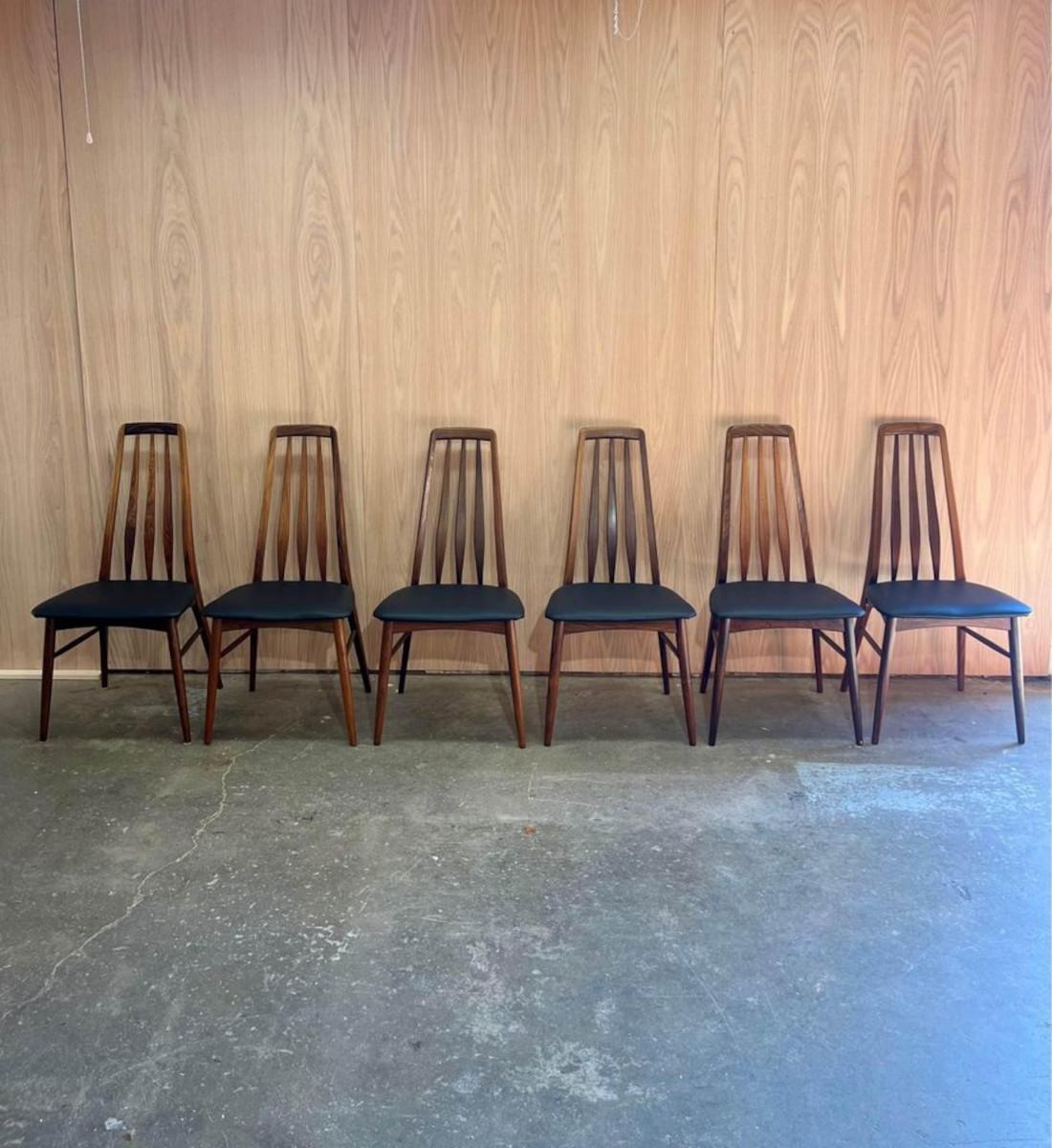 We are pleased to offer this set of 1960s Rosewood Eva dining chairs by Nils Koefoed, freshly upholstered in a top grain aniline leather. This uncommon collection includes 8 chairs, 2 of which have beautifully sculpted arms, showcasing superior