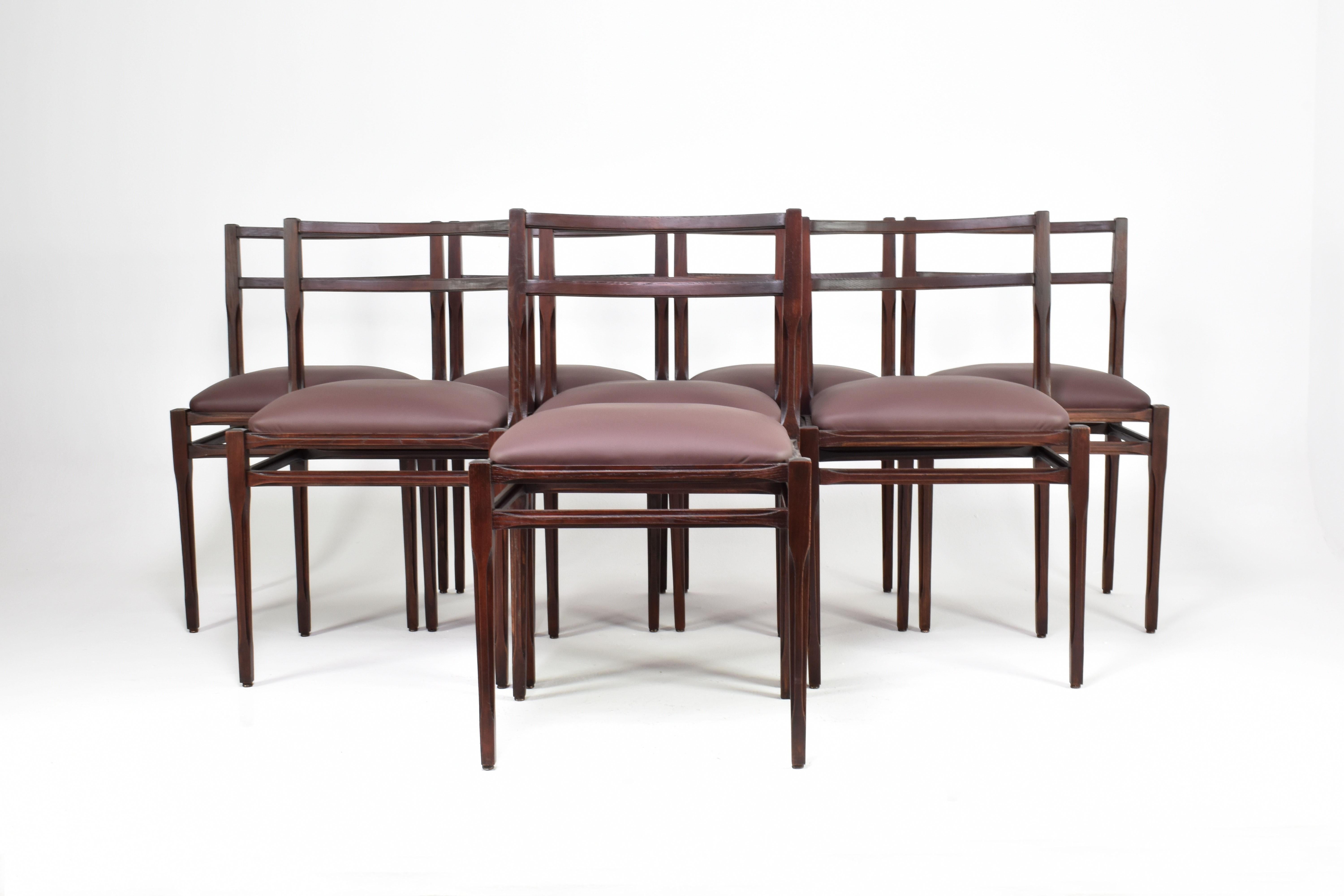 Set of 8 1970s Italian Leather & Wooden Dining Chairs in the Style of Stildomus 

A meticulously restored set of eight Italian dining chairs, from the 1970s and attributed to the refined aesthetic of Stildomus. 
These collectible pieces showcase an