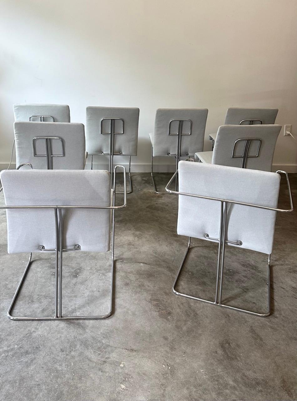 This is a rare set of 8 chrome Saporiti Italia chairs designed by Ernesto Redaelli in the 1970's.  They  were recently reupholstered in a durable neutral Knoll fabric. Two of the 