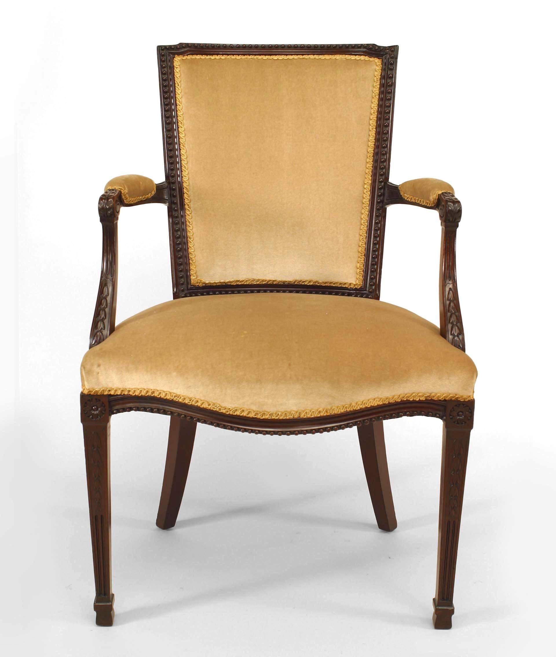 Set of eight English Adam style dining chairs of possible nineteenth century Dutch origin. The chairs are composed of mahogany with squared beige silk upholstered backs and seats above fluted legs.