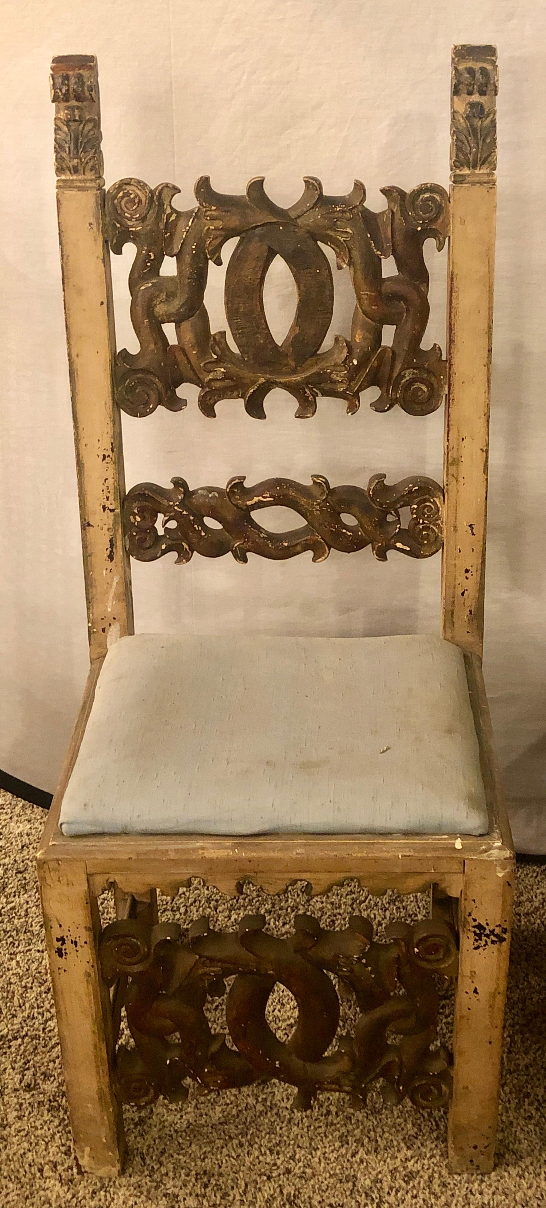 A set of eight finely carved and gilt dining chairs, all finely distress paint decorative with original horsehair seats. Each alternating chair measures 18 in W, 43 in H, 15 in D. with the other alternately chair slightly larger. This fine once in a
