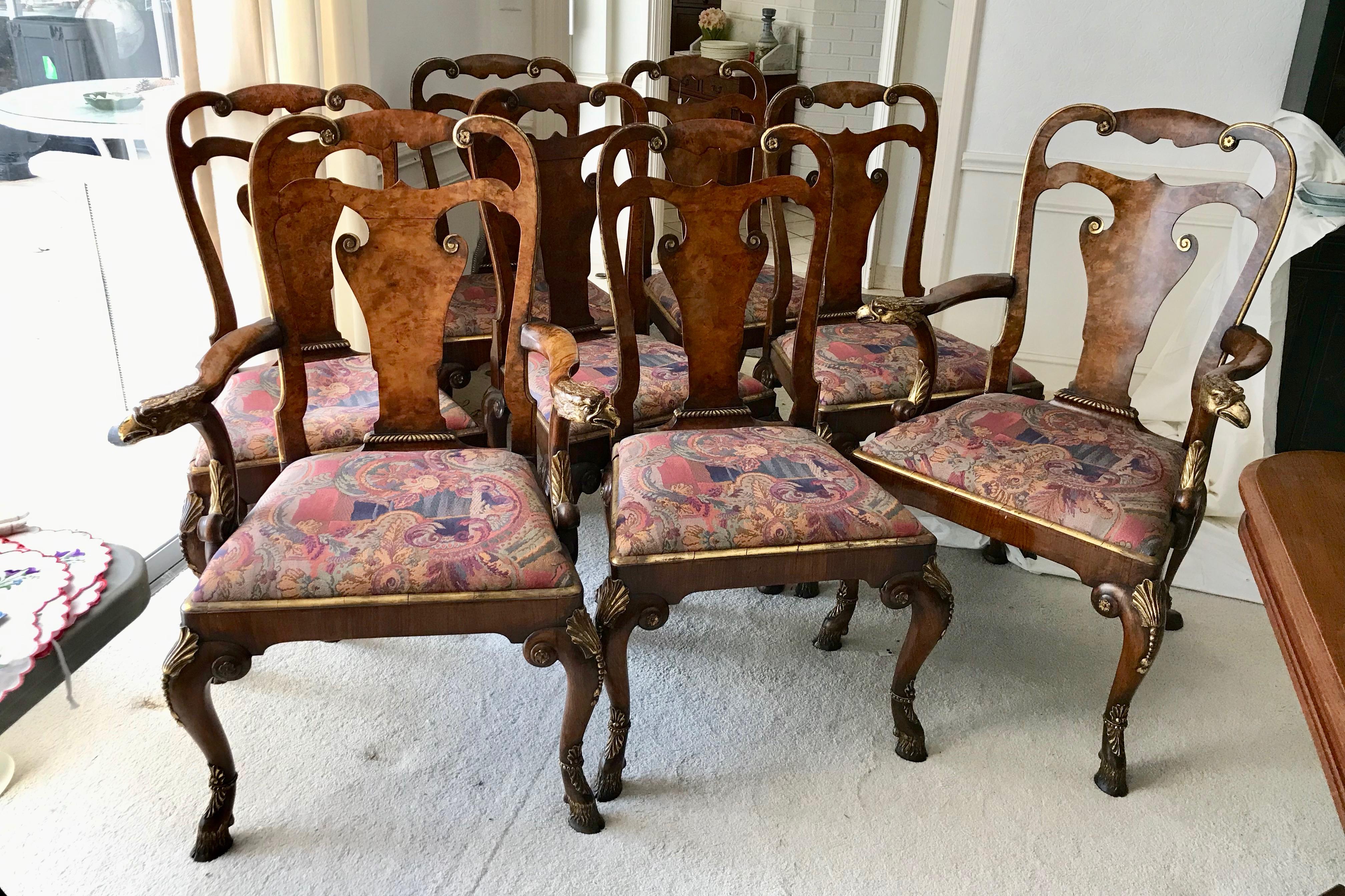 Superb quality and highly stylized form. The chairs are fashioned with fine
burl walnut back rests and appointed with gilt eagle heads on the arm rests of the
