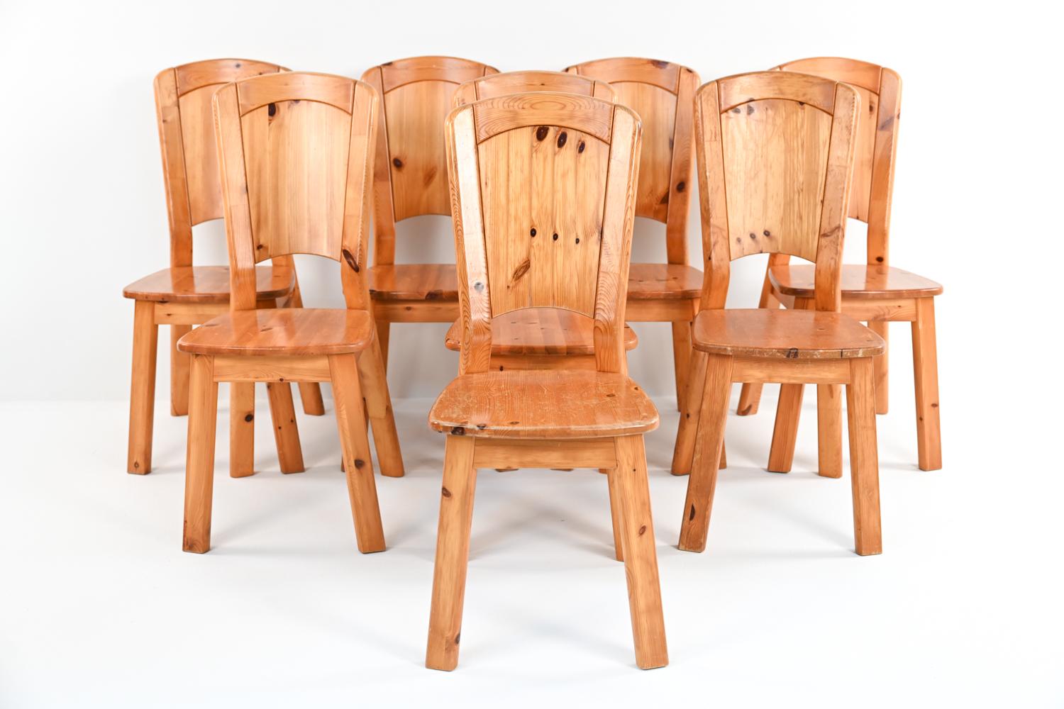 The rich beauty of natural pine takes center stage in this incredible set of (8) side chairs; which feature solid pine frames and seats, and backrests of bentwood with thick paneled pine veneer. Though they are unmarked, they evoke the work of