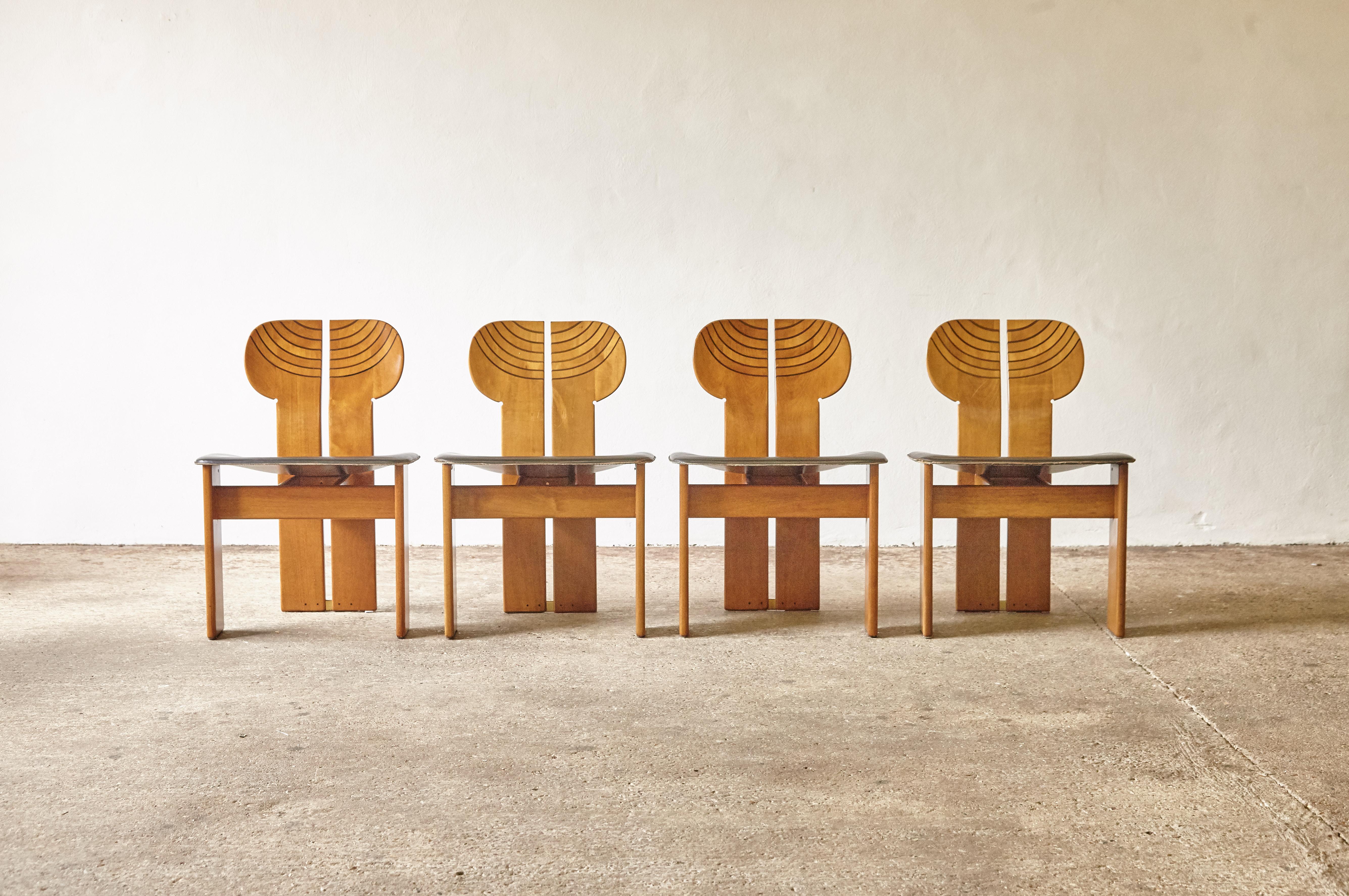 A stunning set of eight Africa chairs designed by Afra & Tobia Scarpa in the 1970s, and produced by Maxalto, Italy. Good original condition with normal minor age related signs of use and wear. Walnut, burl, black leather and brass. Nice patina to