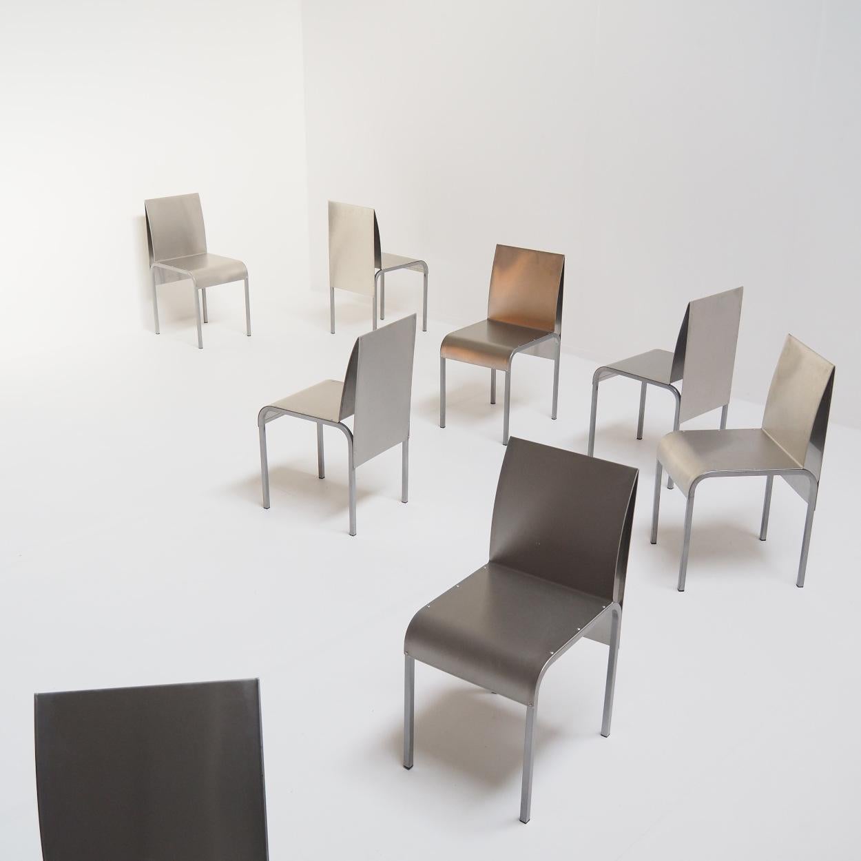 Set of 8 dining room chairs made from one folded aluminum sheet. The legs are in metal. The chairs are made in Belgium, but the designer and manufacturer are unfortunately unknown.

The chairs are in good condition with some light signs of wear