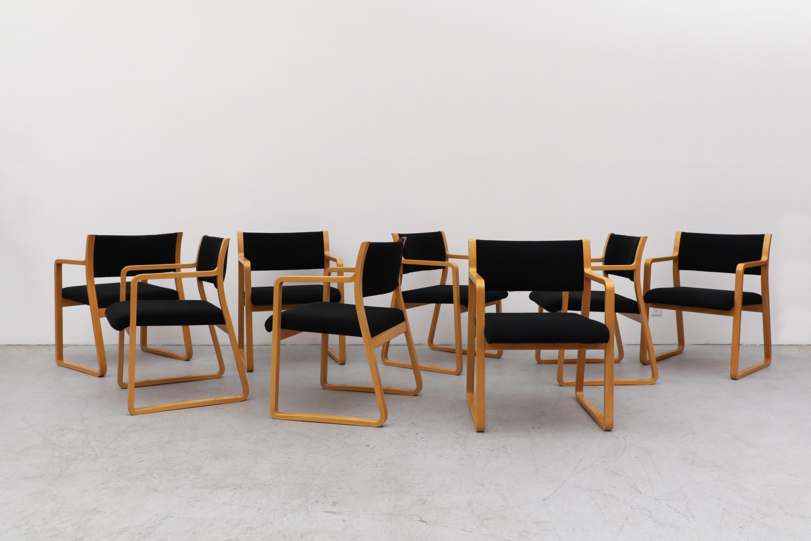 Set of 8 Alvar Aalto style Danish Armchairs with black upholstered seating. Beautiful bent wood frames with original black fabric. Seat width is 19.5
