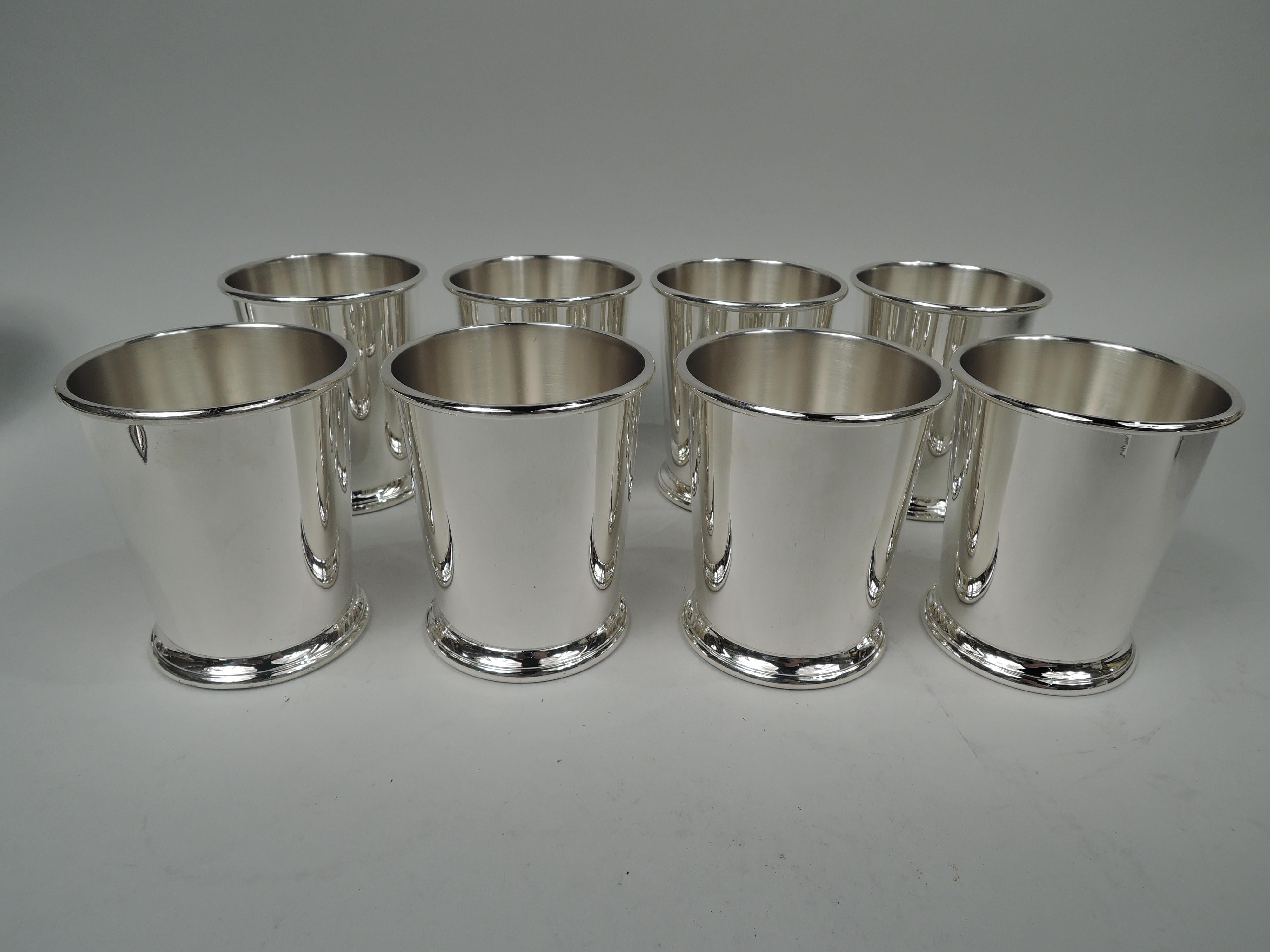 Set of 8 American sterling silver mint juleps. Each: Straight and tapering sides, molded mouth rim, and skirted foot. Marked “Sterling / 0040”. Total weight: 38 troy ounces. 
