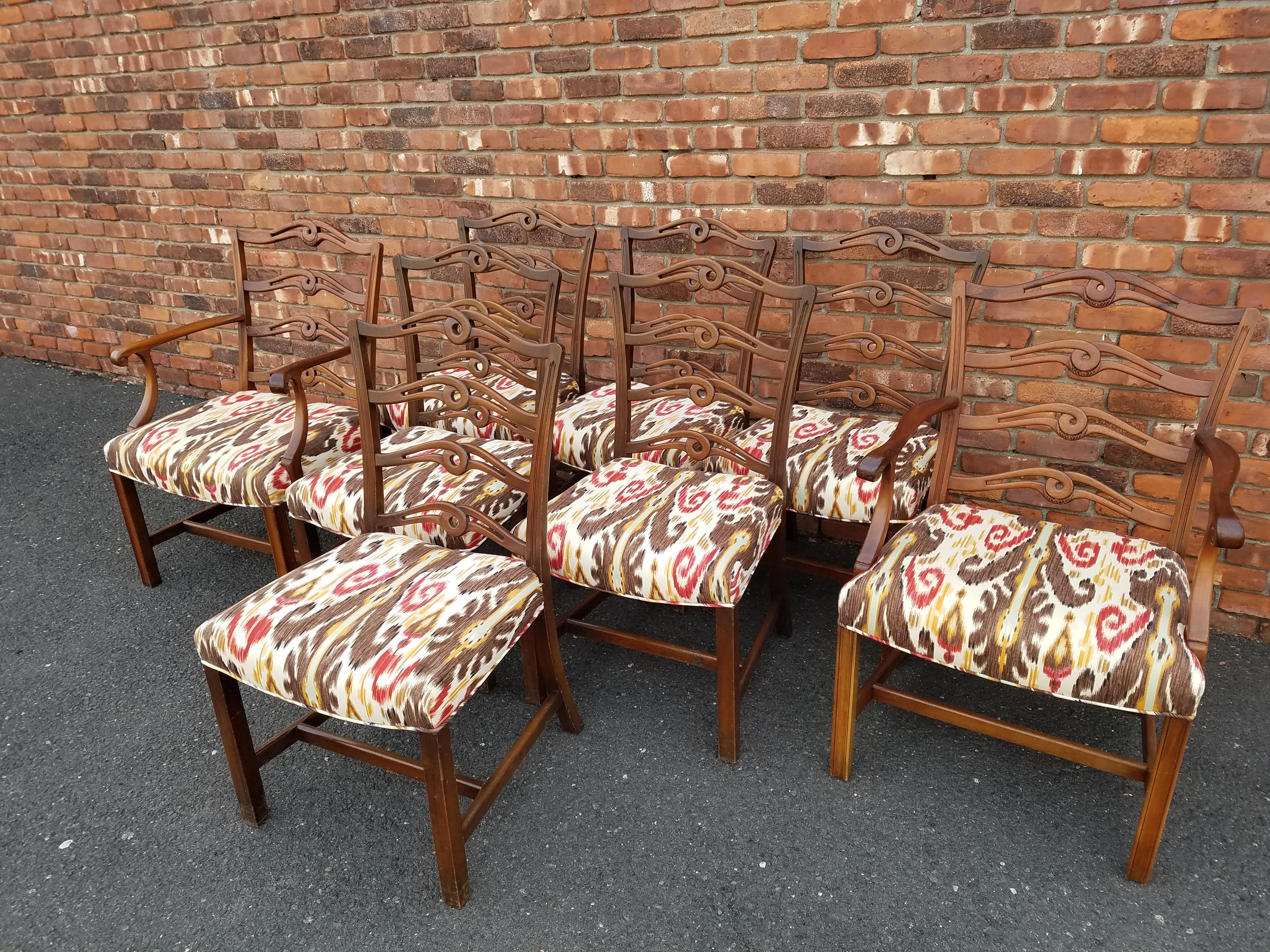 Set of 8 vintage American walnut dining chairs. 2 armchairs and 6 side chairs. Newley reupholstered and refilled using a transitional cotton design in red, gold, brown on a white background. There are no rips or stains in the upholstery. Nice and