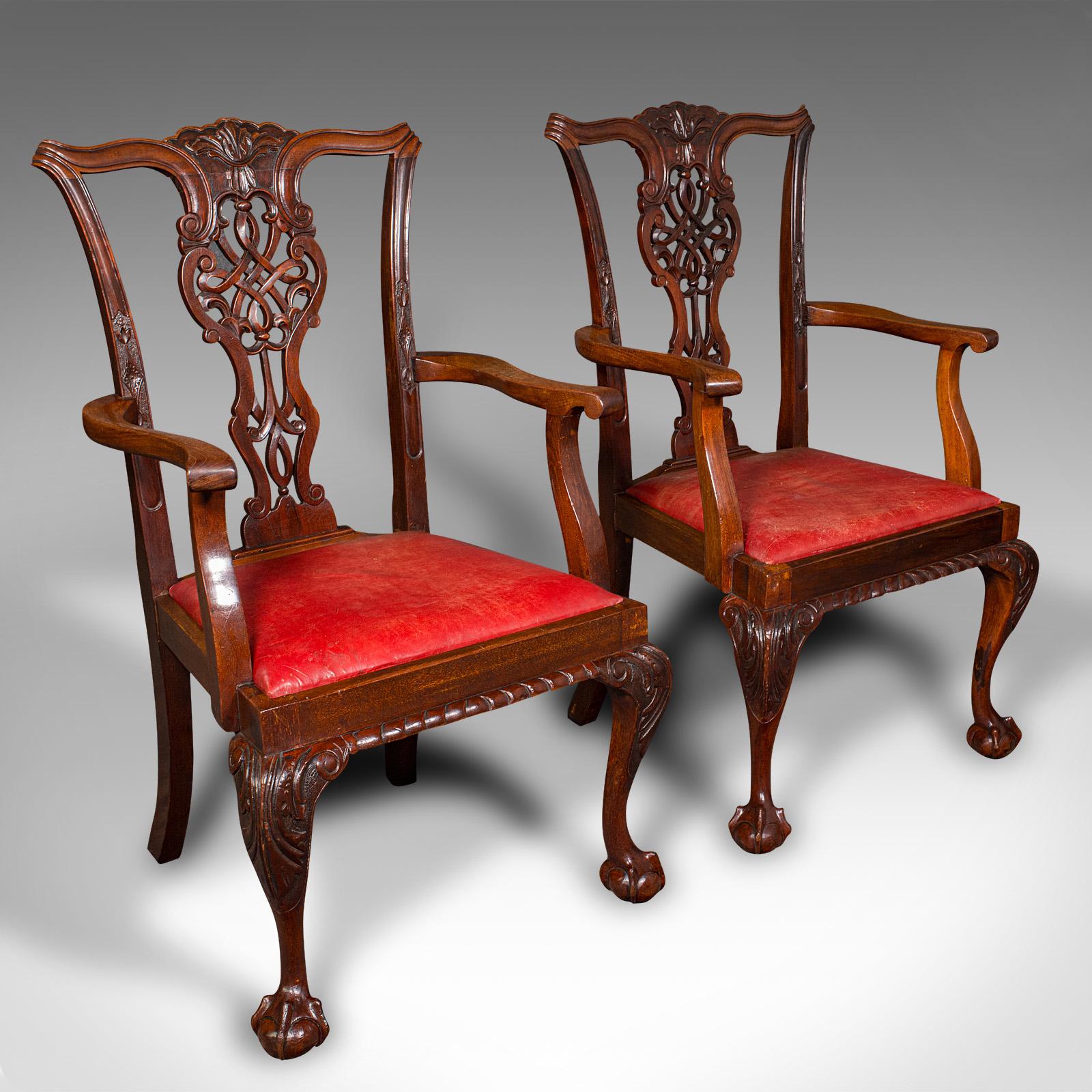 This is a set of 8 antique dining chairs. An English, mahogany and leather seat with Chippendale revival taste, dating to the late Victorian period, circa 1900.

Generously sized, ornate suite of 8 dining chairs for the grandest of dining