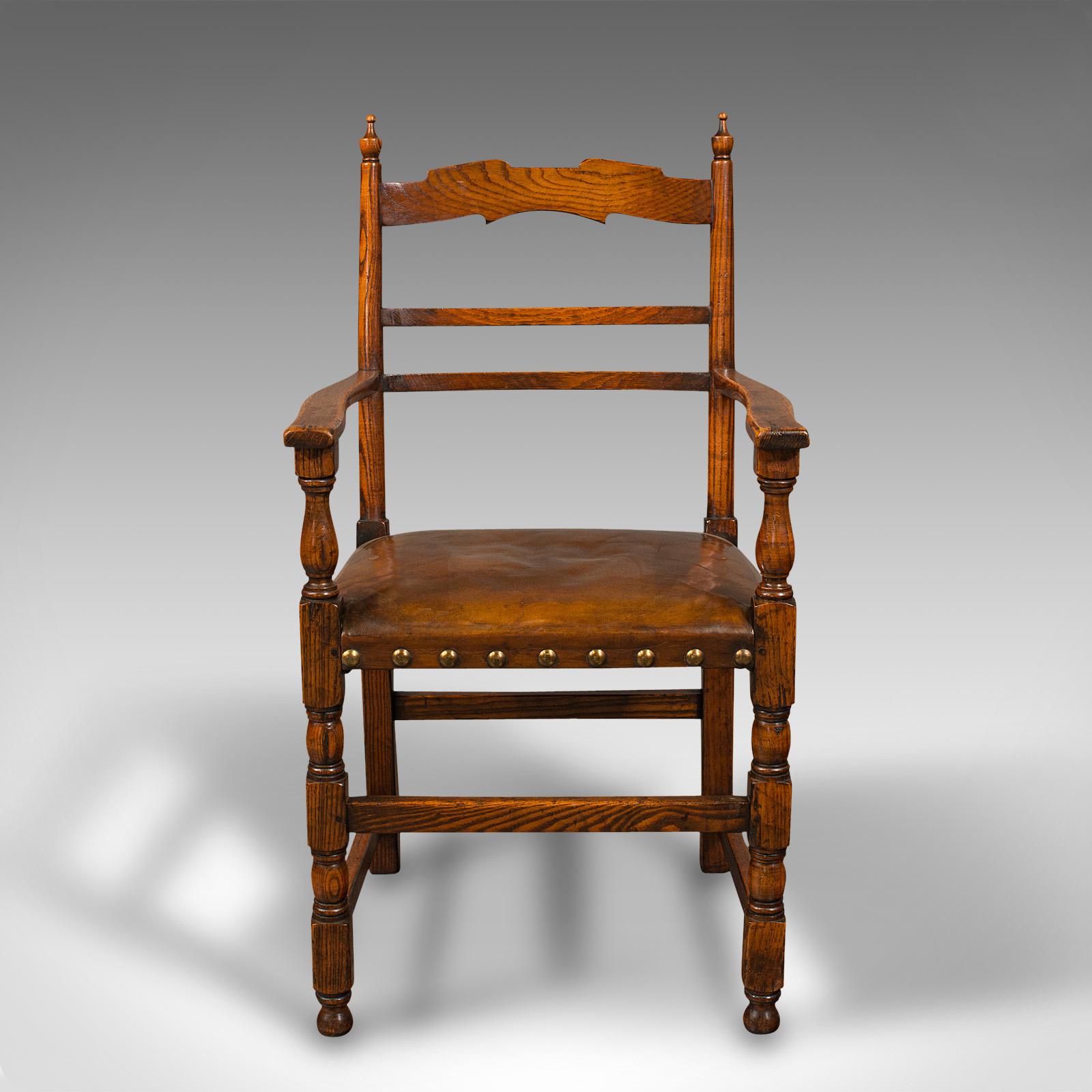 This is a set of 8 antique dining chairs. An English, oak carver and seat with leather cushions, dating to the Edwardian period, circa 1910.

Graced with delightful oak stocks and of appealing comfort
Displays a desirable aged patina and in good