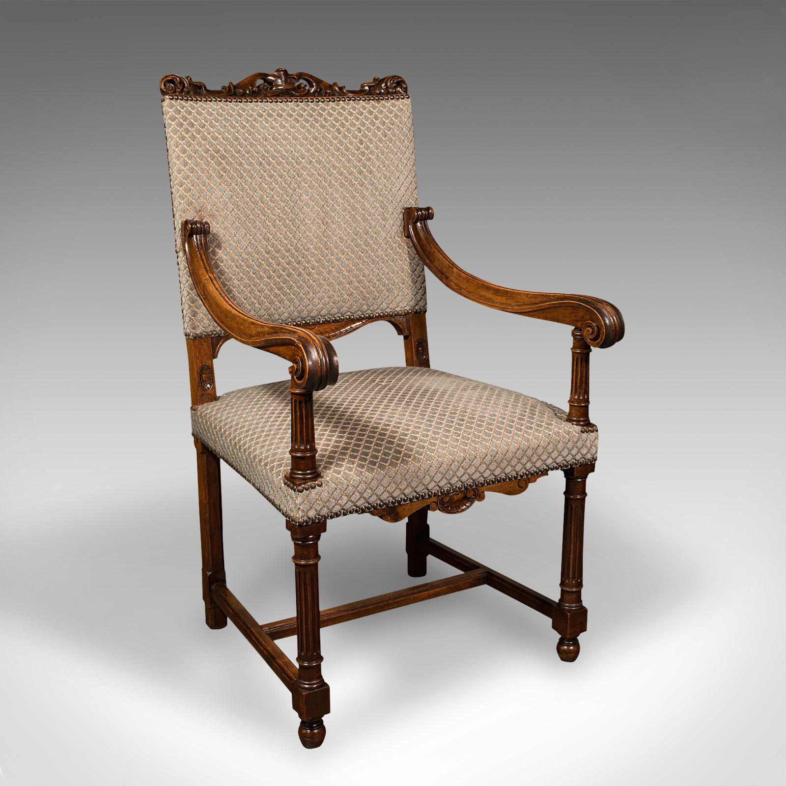 This is a set of 8 antique dining chairs. An English, walnut carver and seat with upholstered cushions, dating to the Edwardian period, circa 1910.

Graced with delightful walnut stocks and of appealing form
Displaying a desirable aged patina and