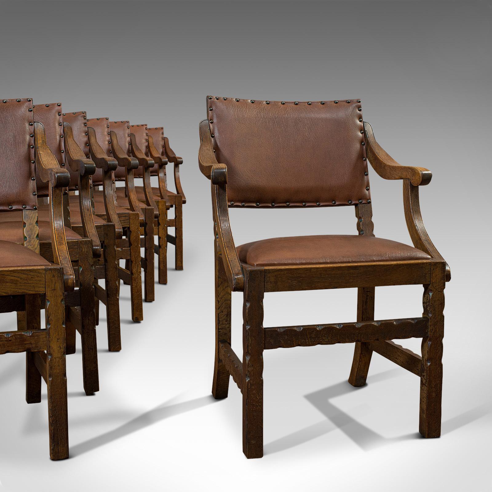 This is a set of 8 antique dining chairs. An oak, faux leather upholstered seat in Arts & Crafts taste by Hamptons, dating to the Edwardian period of the early 20th century, circa 1910.

Attractive and generous set of chairs
Displays a desirable