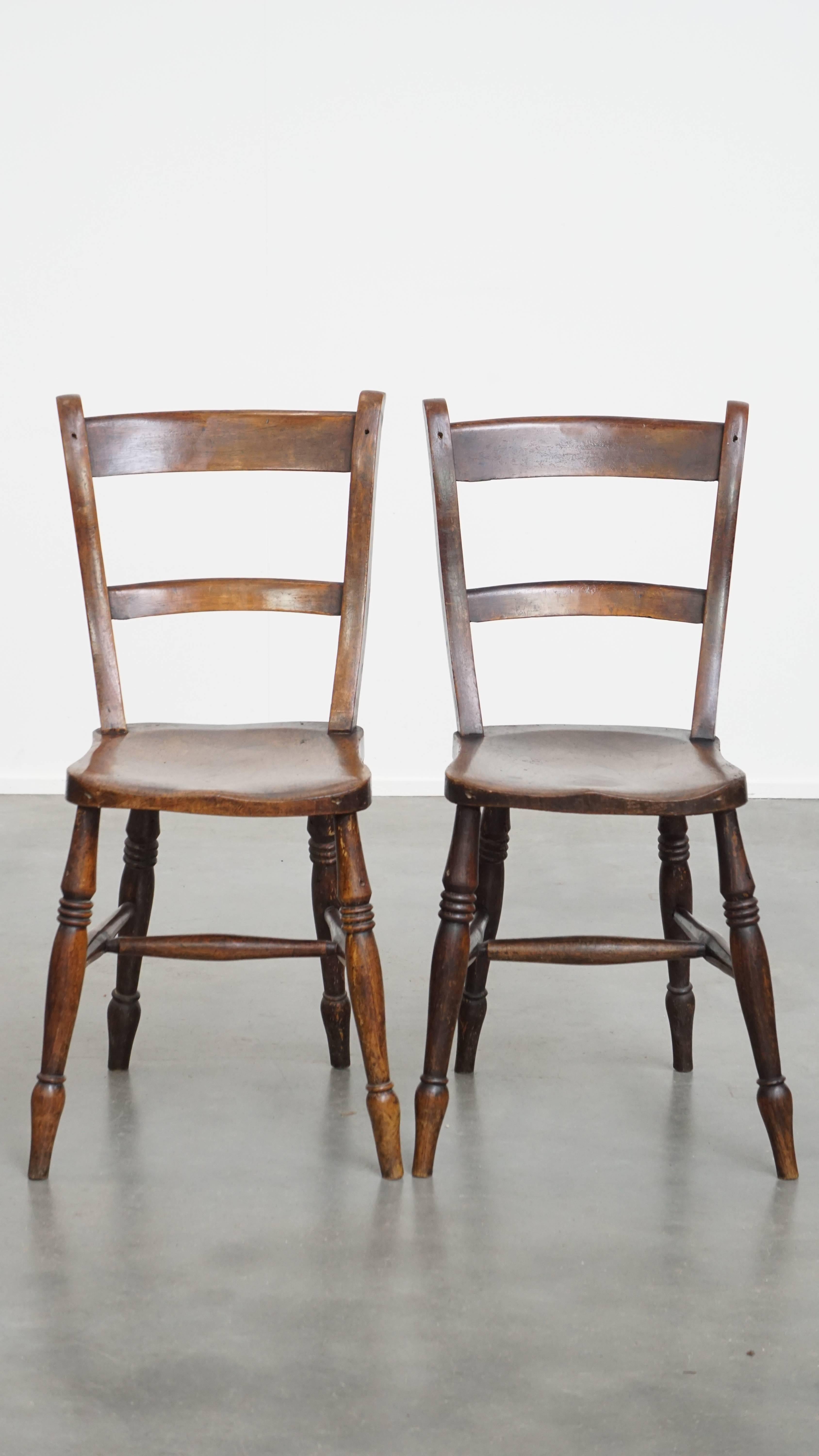 Offered is this timeless and elegant set of 8 antique English Oxford dining / kitchen chairs with a warm color palette.
This beautiful set of 8 antique Oxford chairs is not only perfectly suited for a homely environment but also works wonderfully in