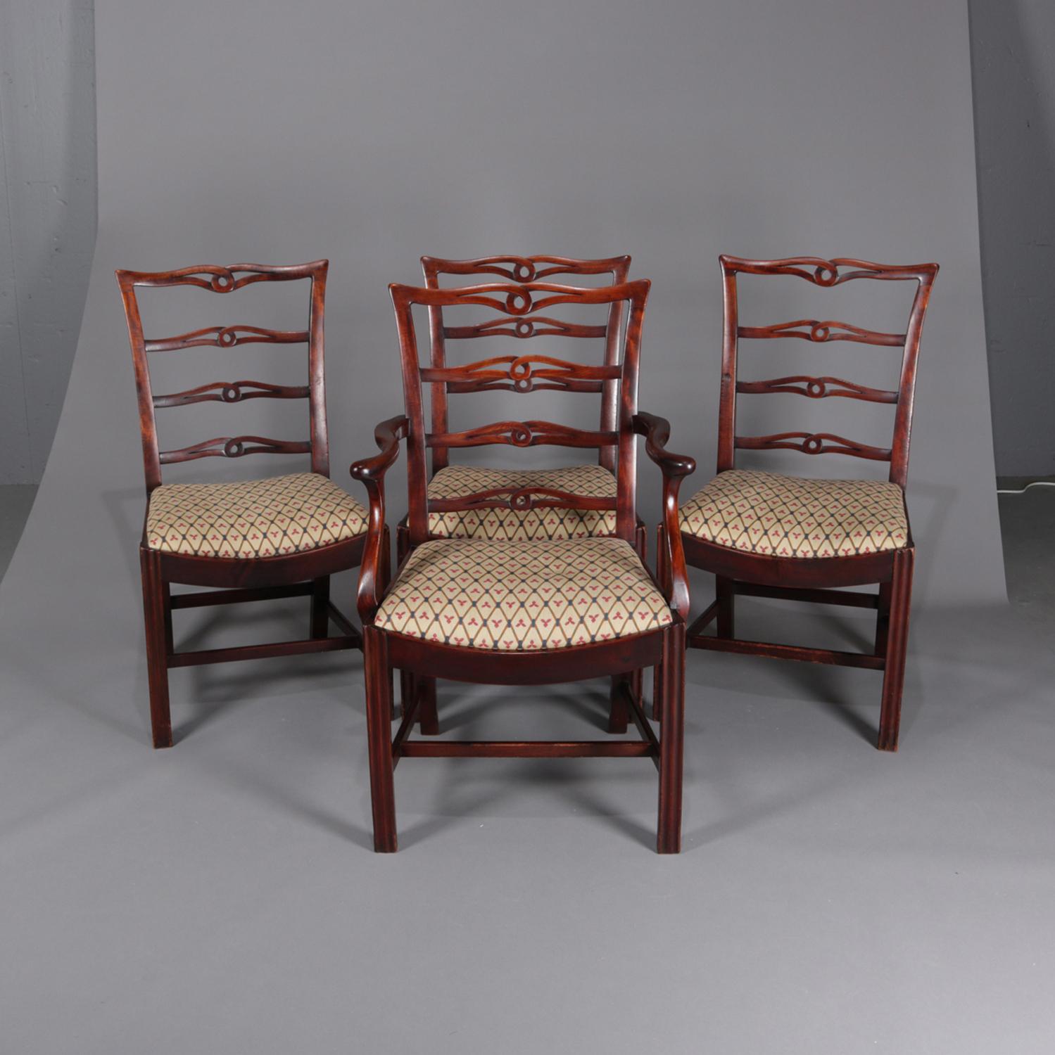 A set of eight Federal style dining chairs feature mahogany frames having laddered and pierced ribbon backs, upholstered seats and are raised on straight legs, includes two armchairs and six side chairs, circa 1930.

Measures: side chairs 38