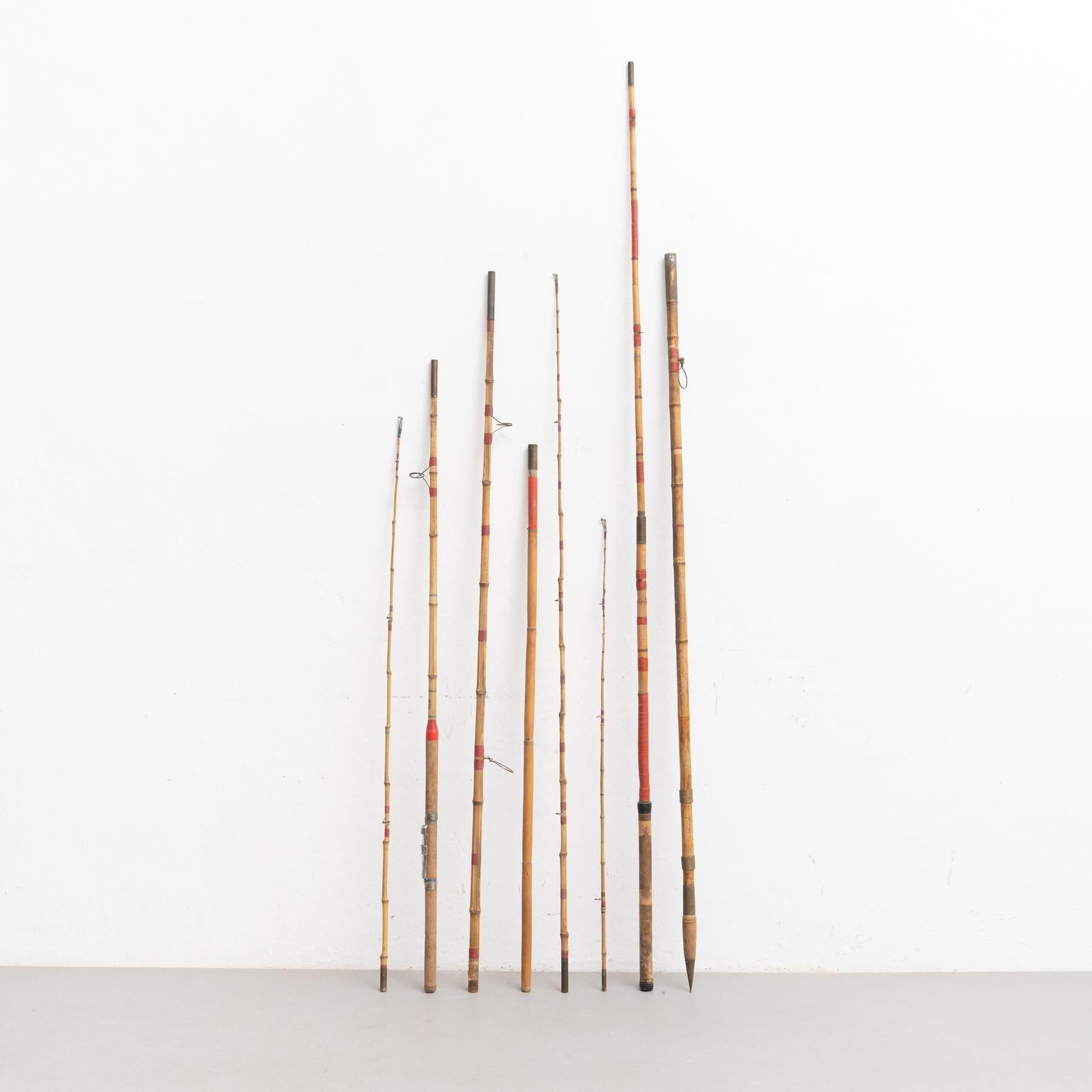 Set of 8 antique fishing big fishing rods and parts.    Made in Spain, circa 1900.    In original condition, with minor wear consistent with age and use, preserving a beautiful patina.    Materials:  Metal.  Wood    The sculptural part pieces are