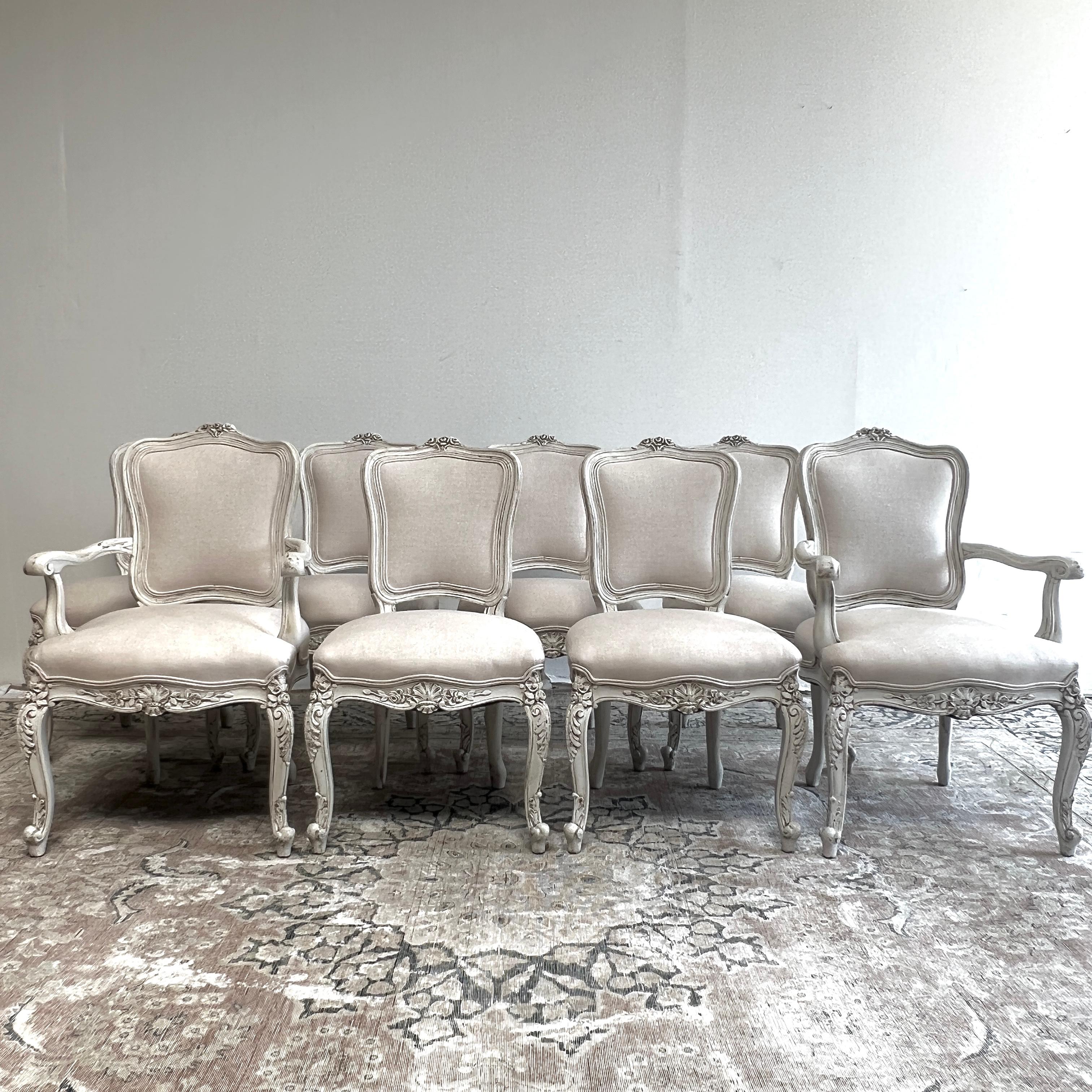 Set of 8 dining chairs painted in a french antique white, upholstered in a heavy weight natural linen, finished with a double welt trim.
Solid and sturdy, ready for everyday use.

ARM CHAIR DIMENSIONS:
24
