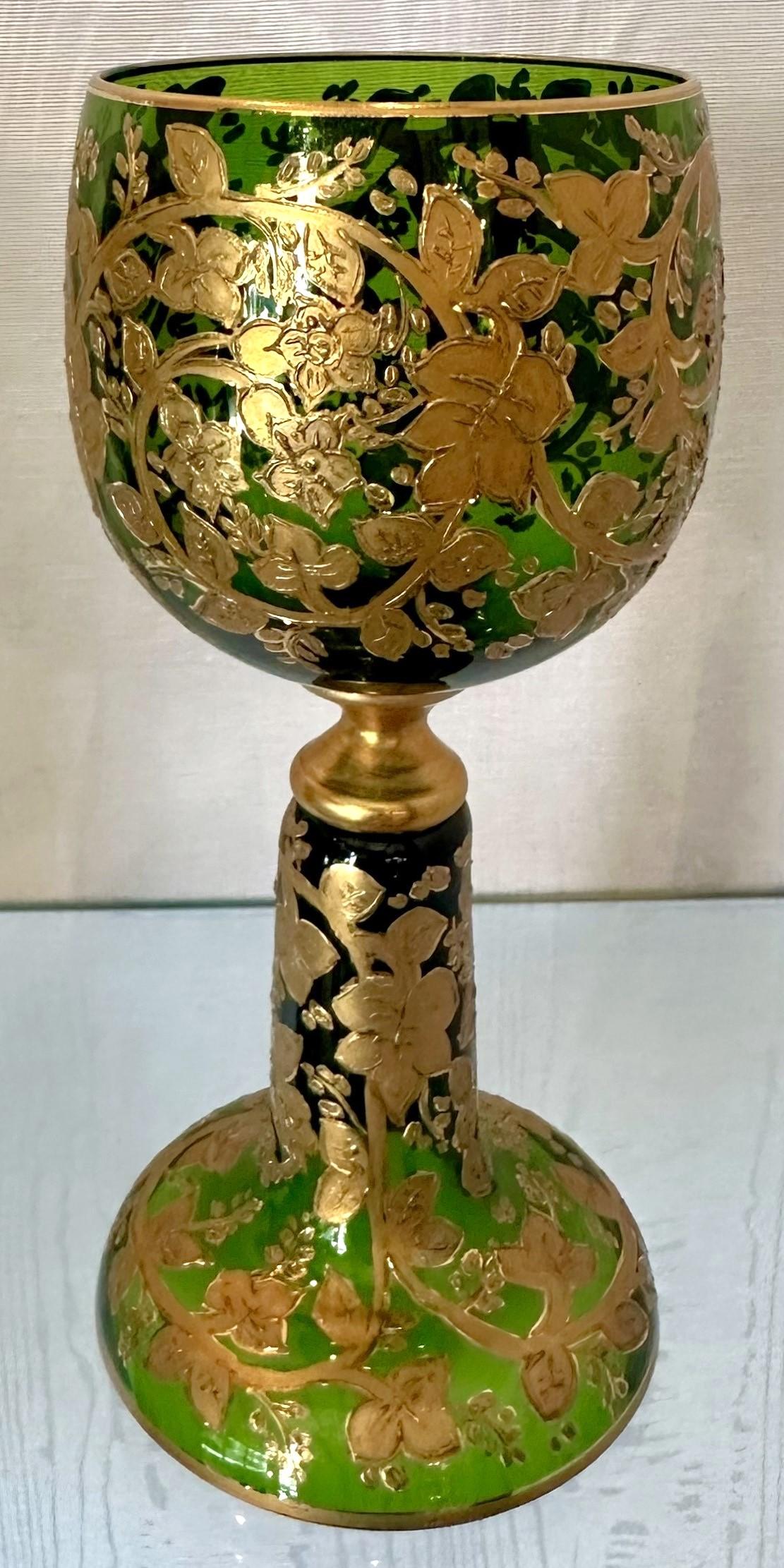 Set of 8 Antique German Gold Encrusted Green Glass Wine Goblets Made by Moser Company, Circa 1890-1910.  These are for red wine.
Per the last 3 photos, we have a matching set of 10 white wine glasses and a set of 10 water / pilsner glasses (not