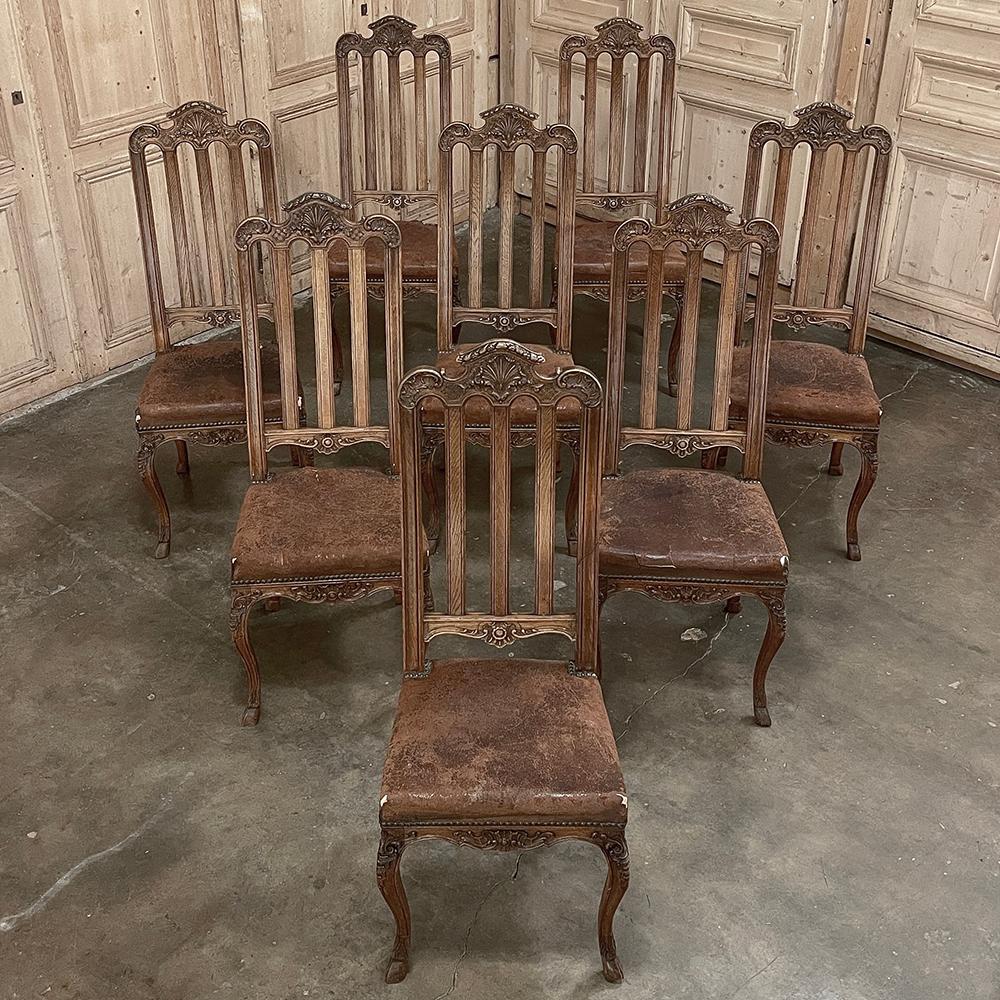 Set of 8 Antique Liegoise Louis XIV Dining Chairs were meticulously handcrafted by the master artisans of the storied region around Liege. Utilizing dense, old-growth indigenous oak, frameworks were created which include seatback posts that are one