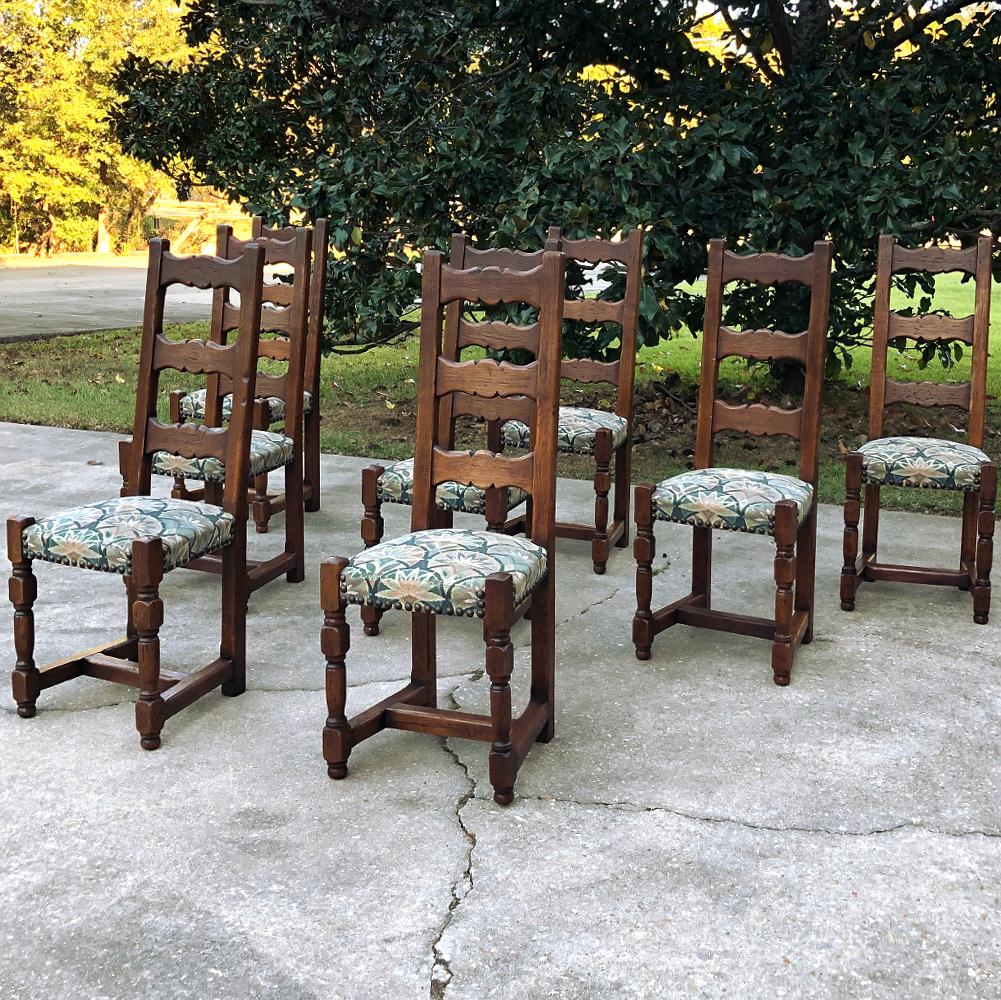 Set of 8 Antique Rustic dining chairs were crafted with obvious pride from solid oak, and feature a tailored architecture enhanced by contoured back splats, turned legs, and tapestry-grade upholstery that is still quite serviceable. The typical 
