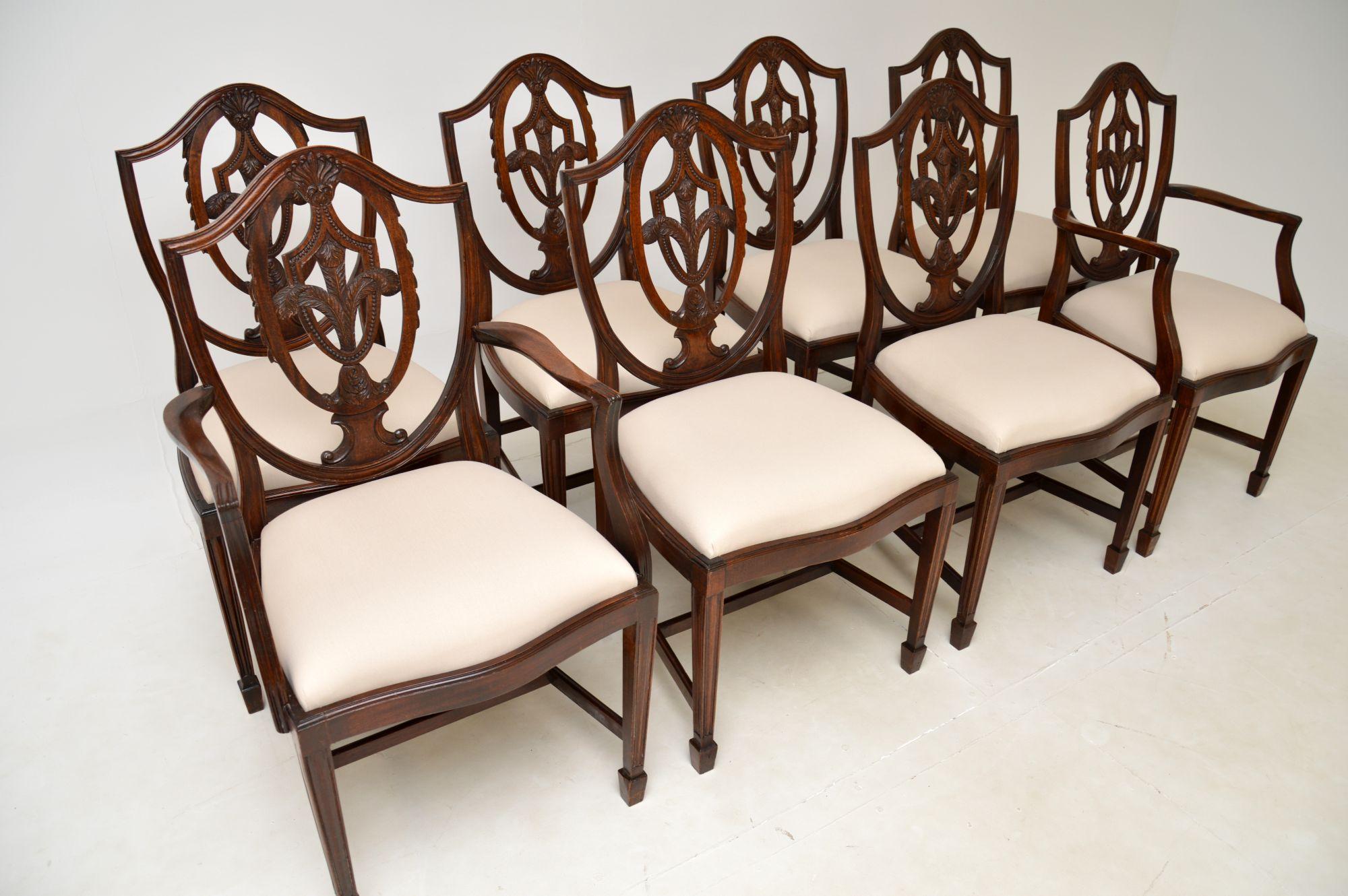 A lovely set of eight antique shield back dining chairs in the Sheraton style. They were made in England, and date from around the 1930’s.

The quality is superb, they have beautifully carved pierced back rests with Prince of Wales feather motifs.