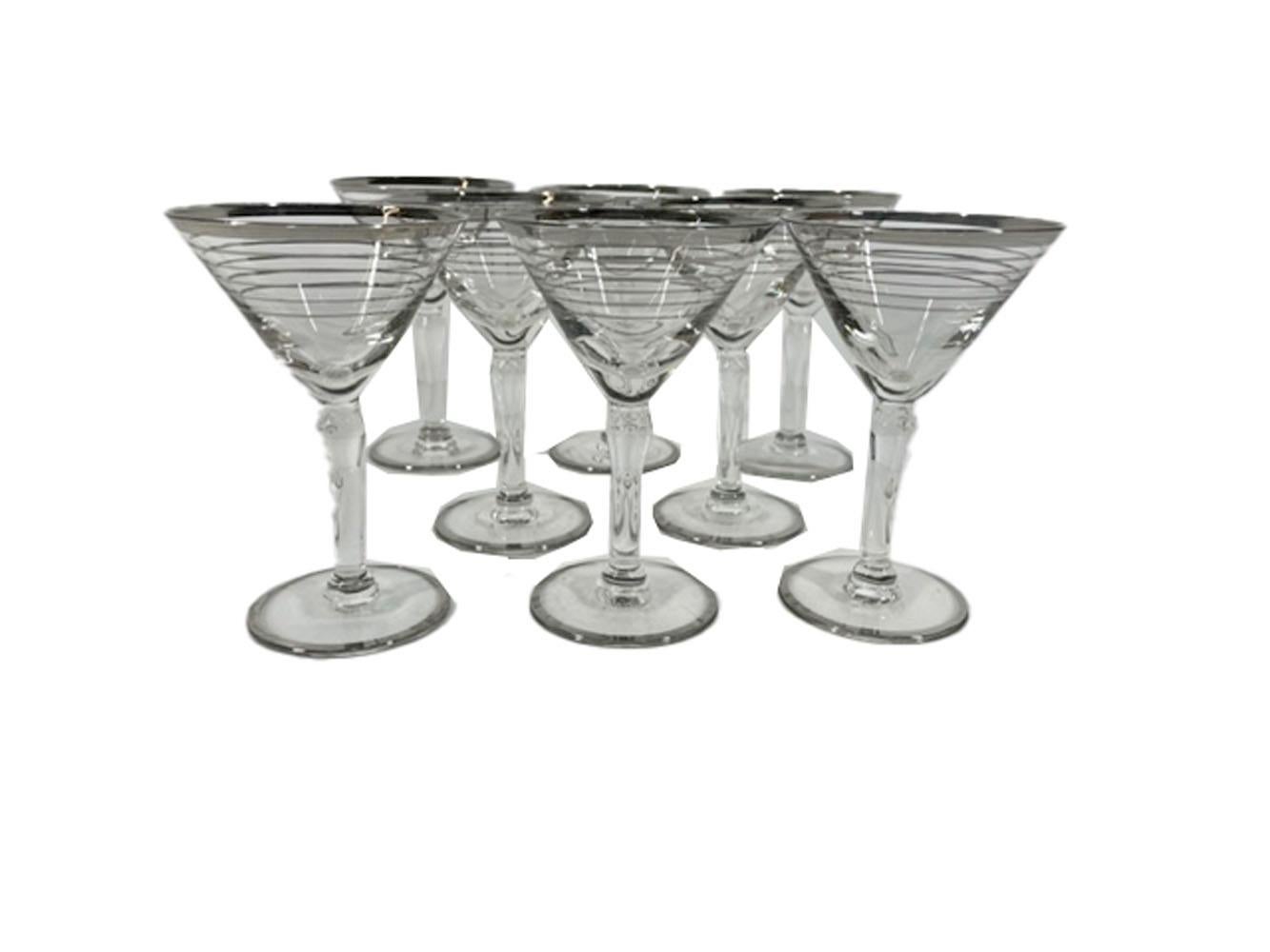 Eight Art Deco cocktail / martini glasses with shaped stems and decorated with a platinum band at the rim and foot as well as having platinum lines around the conical bowl. Very good condition.