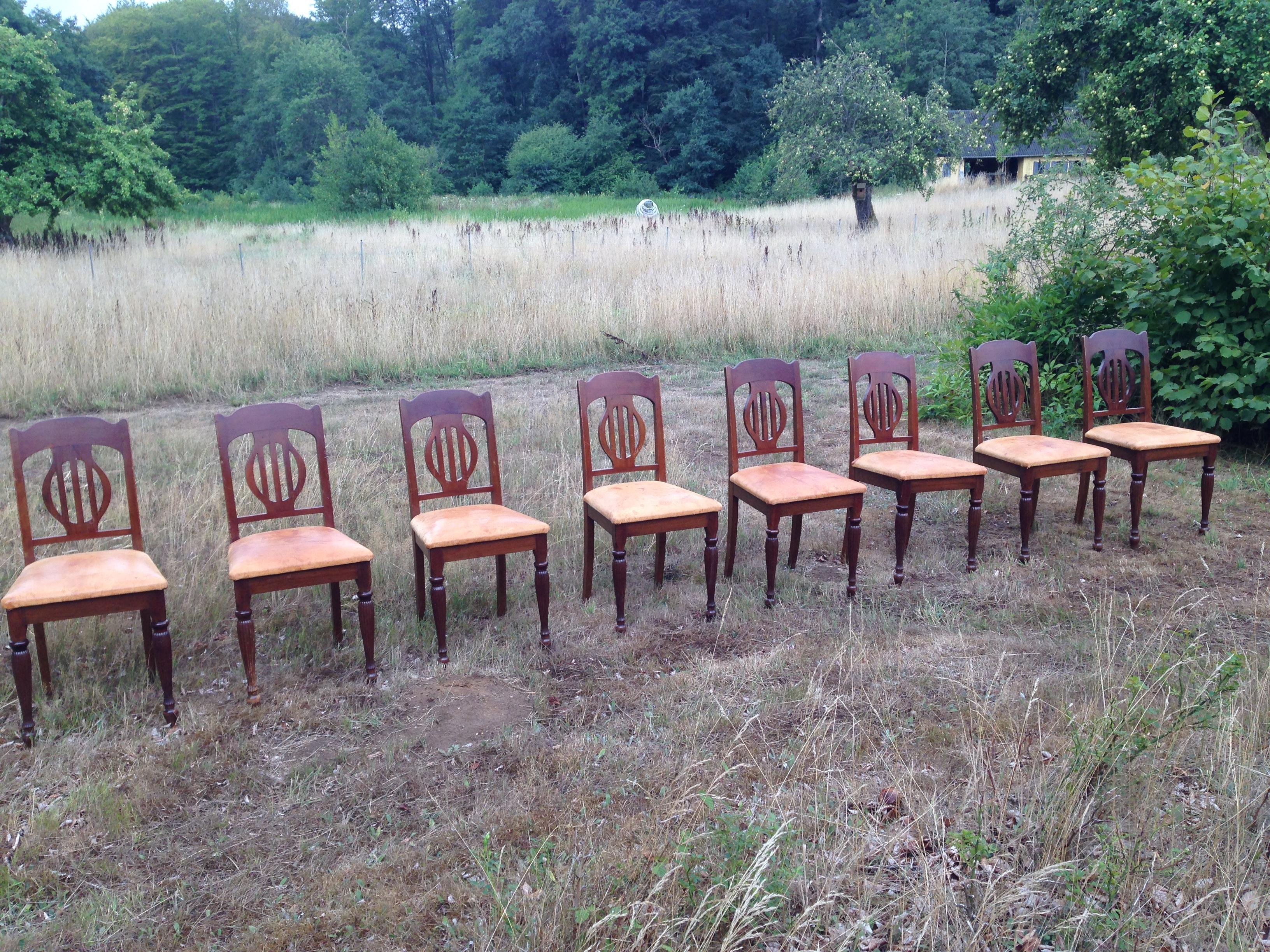 Set of 8 Art Nouveau chairs in mahogany and oxhide, 1910s-1920s. a few chairs with repairs on back.