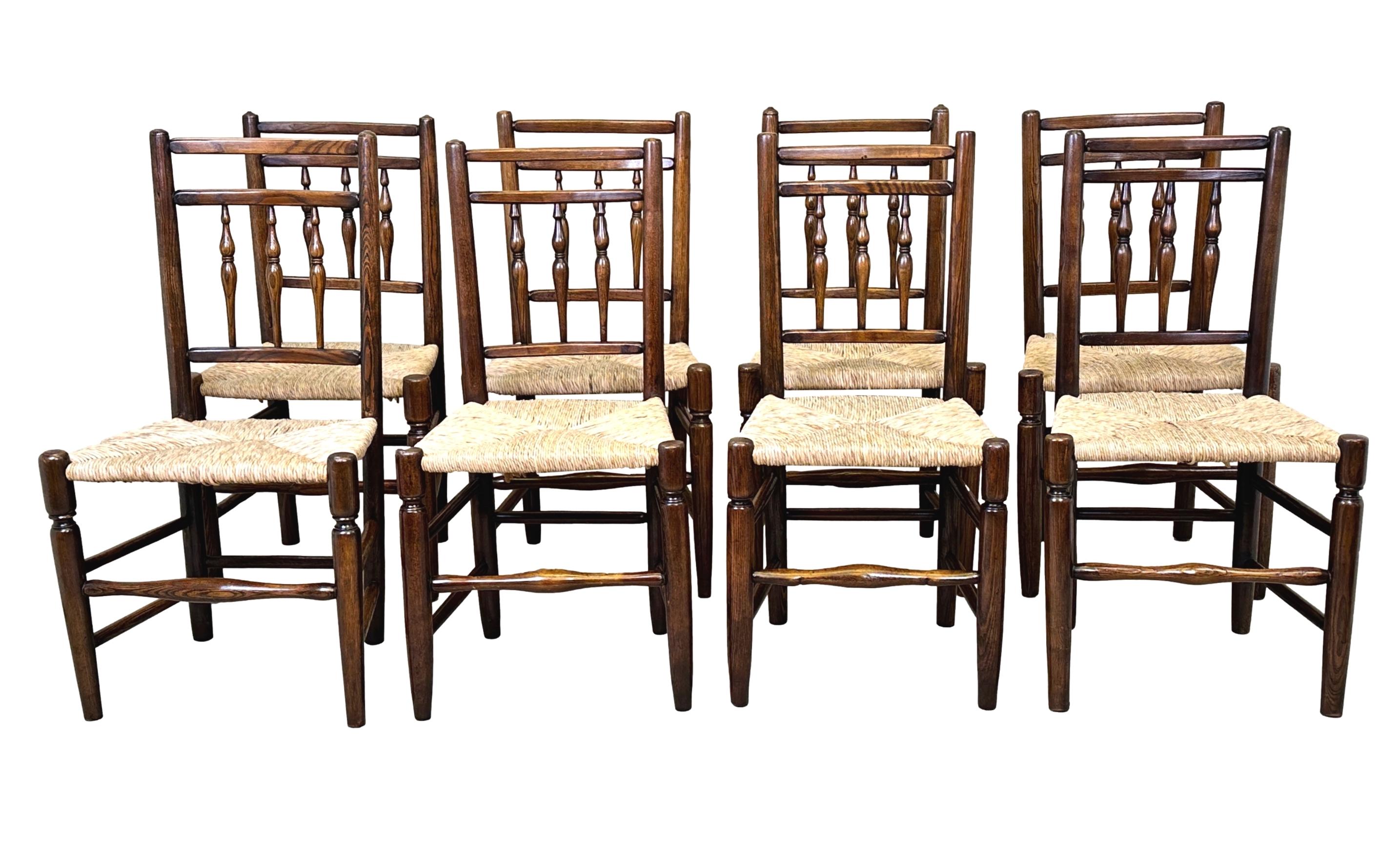 An extremely attractive set of eight, mid-19th century, Ash Kitchen Windsor Dining Chairs, In The Manner Of Philip Clissett, With Elegant Spindle Turned Decoration To Backs, Over Attractive Rushed Seats, Raised On Elegant Turned Legs With Single