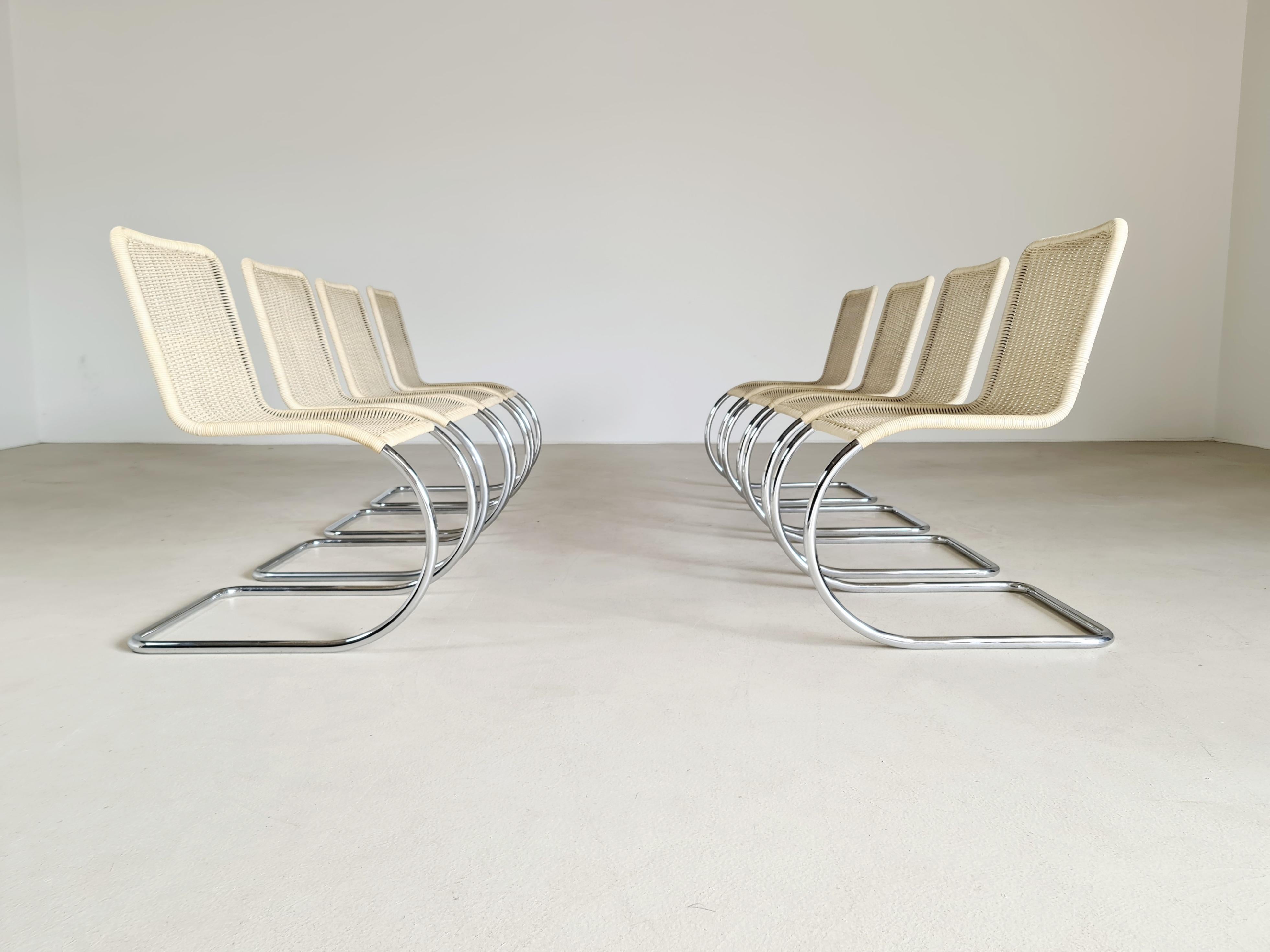 Set of 8 B42/1 cane chairs by Mies van der Rohe for Tecta. Inspired by the chairs of Marcel Breuer, Ludwig Mies van der Rohe replaced the right angles on the front legs with a graceful curve which had the advantage of increasing elasticity. These