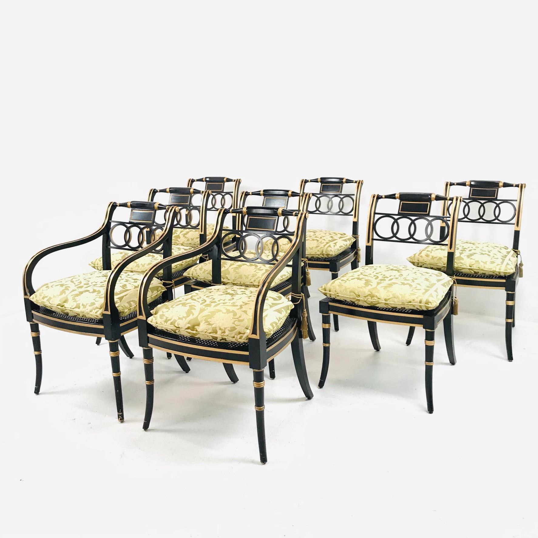 Stunning set of 8 Baker Charleston collection regency dining chairs with cane seats and removable cushions. 2 armchairs and 6 side chairs.
Armchairs measure: 21.5