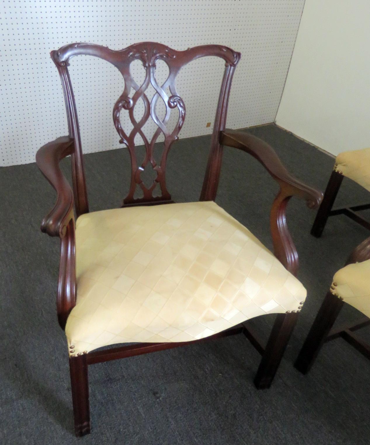 Set of 8 Baker Chippendale style dining chairs with nail head trim. Two armchairs measure 37.5