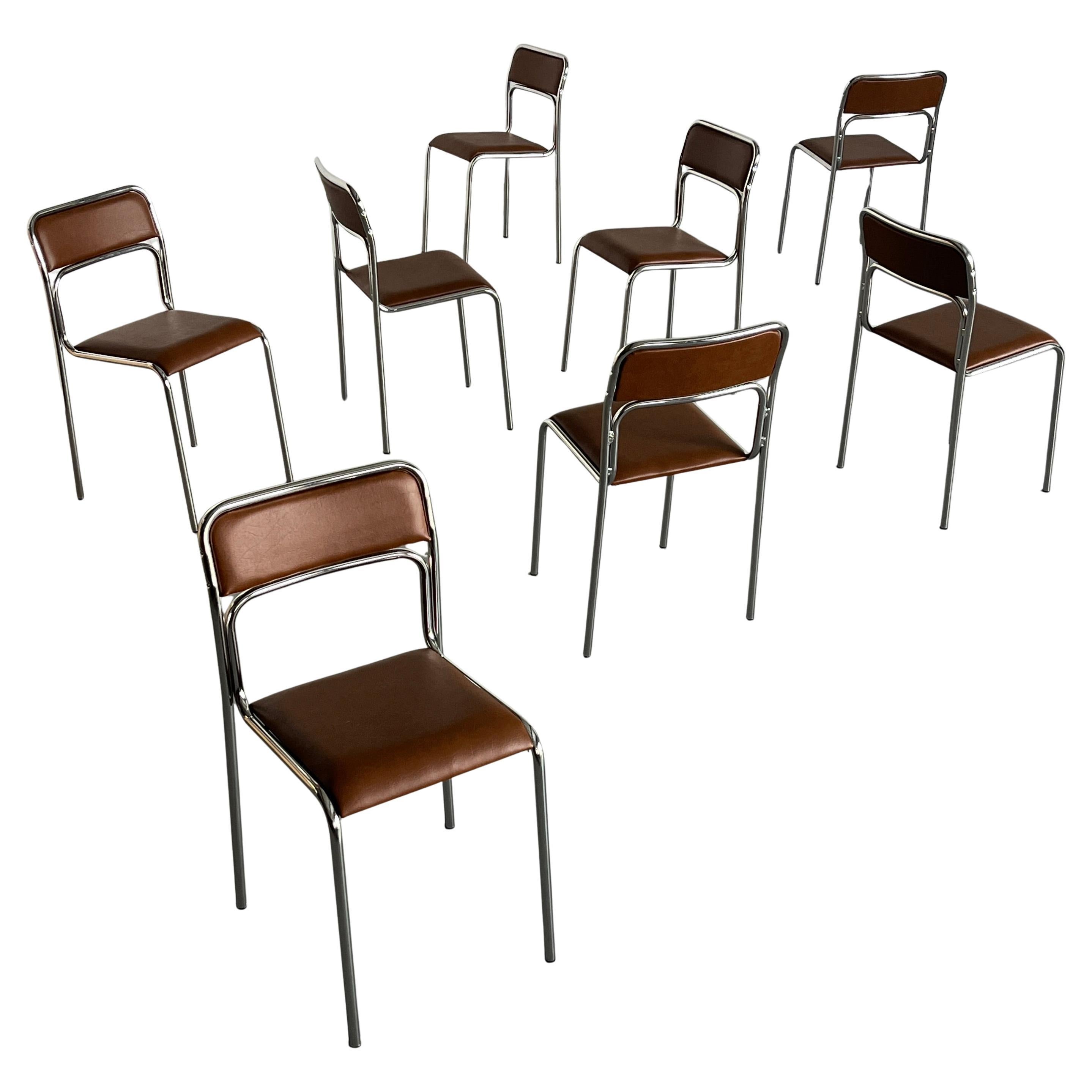 Italian modernist, Bauhaus design tubular chrome and brown faux leather stackable dining or living room chairs. Italian design, 1980s. 

Reupholstered in faux leather.  
In very good vintage condition with some smaller expected signs of age on the