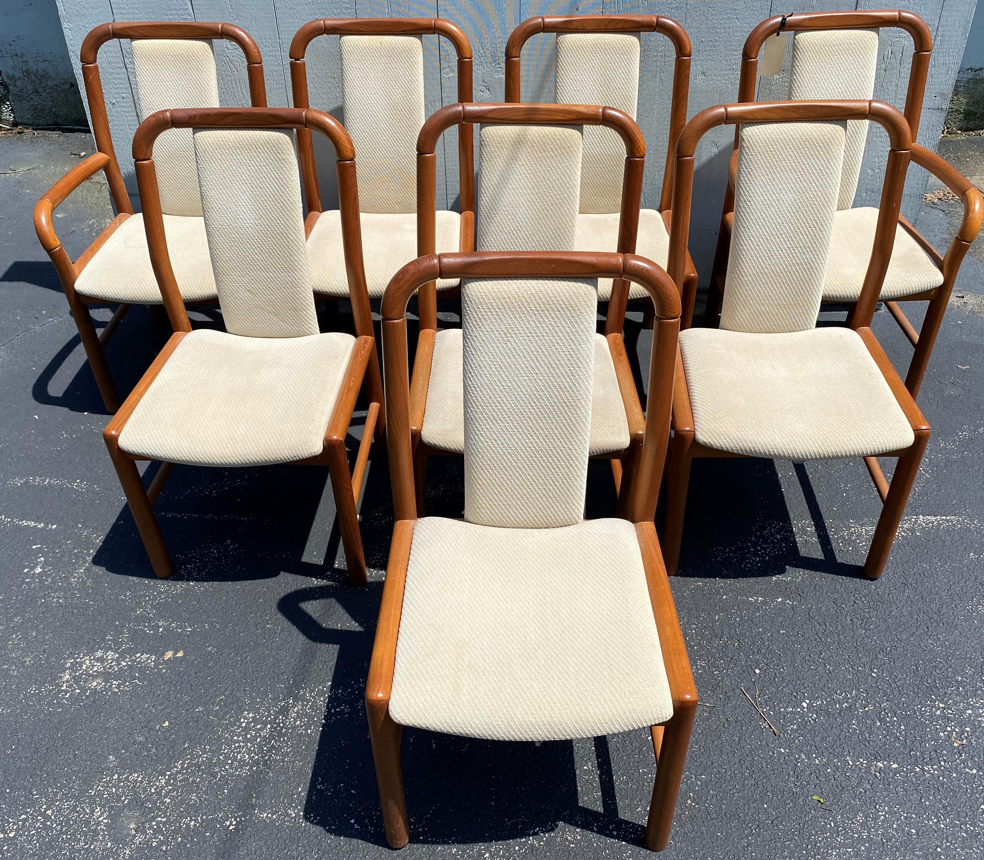 A fine set of mid century Danish modern teak upholstered dining chairs by Benny Linden, including six side chairs and two arm chairs. The chairs each have white upholstered back center supports and seats, and are labeled on the underside, Benny