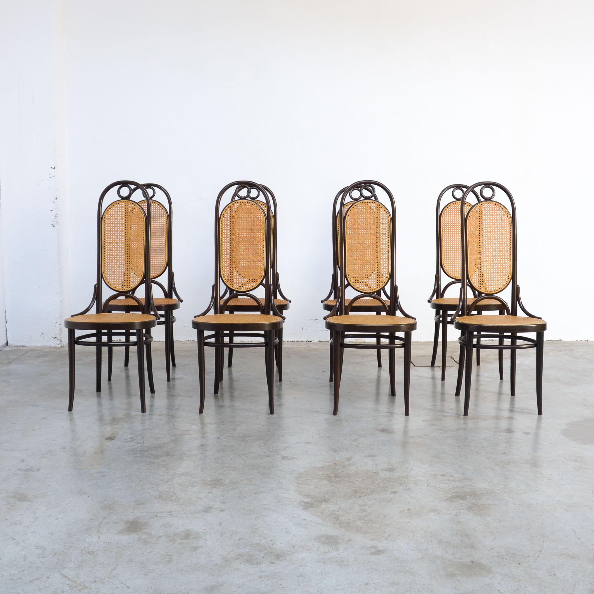 This set of eight bentwood dining chairs model 207R, also known as Long John, was made by Thonet in 1979. The original design dates from the early 20th century but had a revival in the 1970s.
These chairs have dark brown bentwood frames with caned