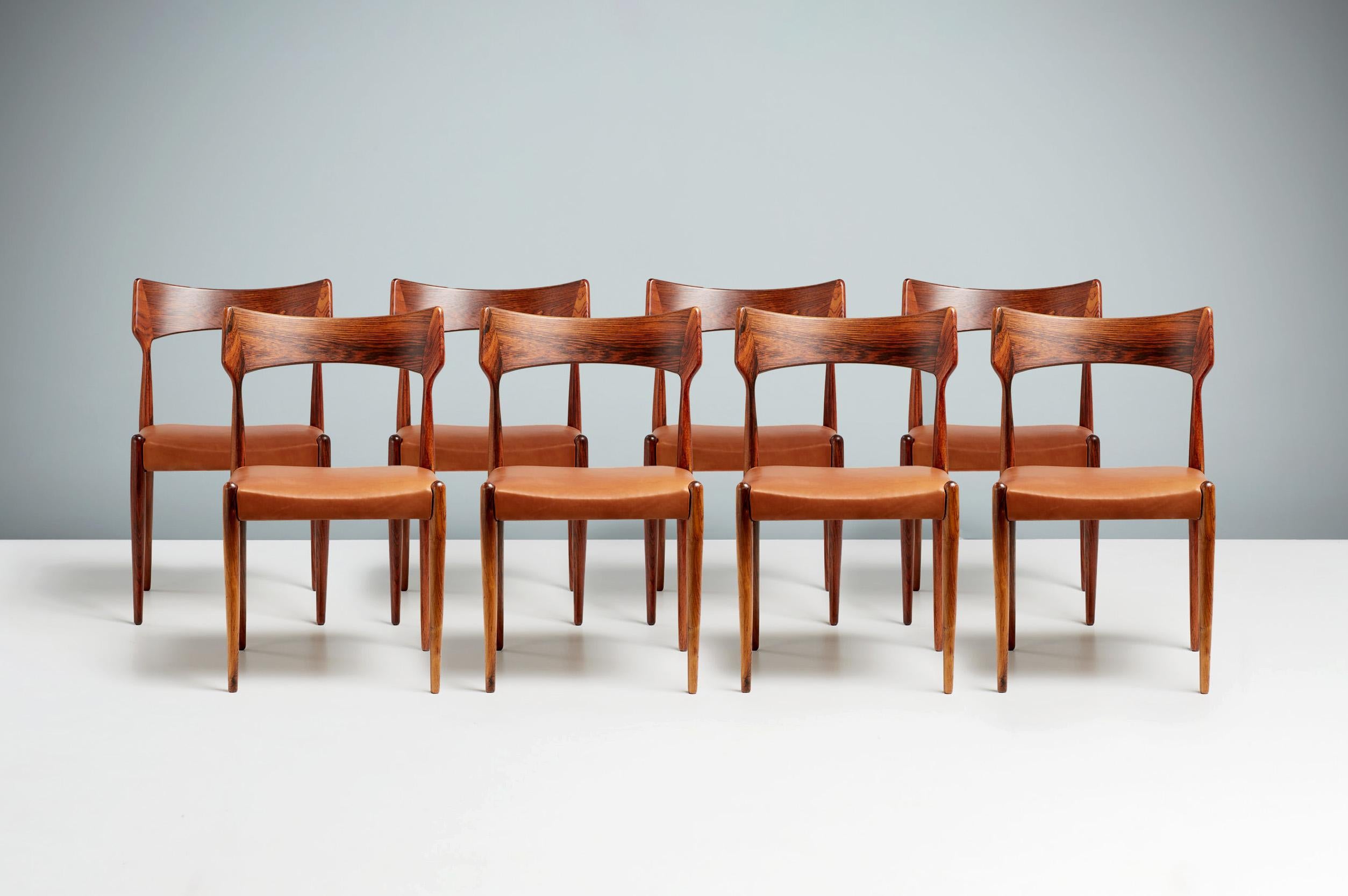 Bernard Petersen - Dining Chairs, circa 1960.

Set of 8 rosewood dining chairs produced by Christian Linnebergs Møbelfabrik, Denmark and designed by Bernard Petersen. The seats have been reupholstered in premium, aniline cognac brown leather and the