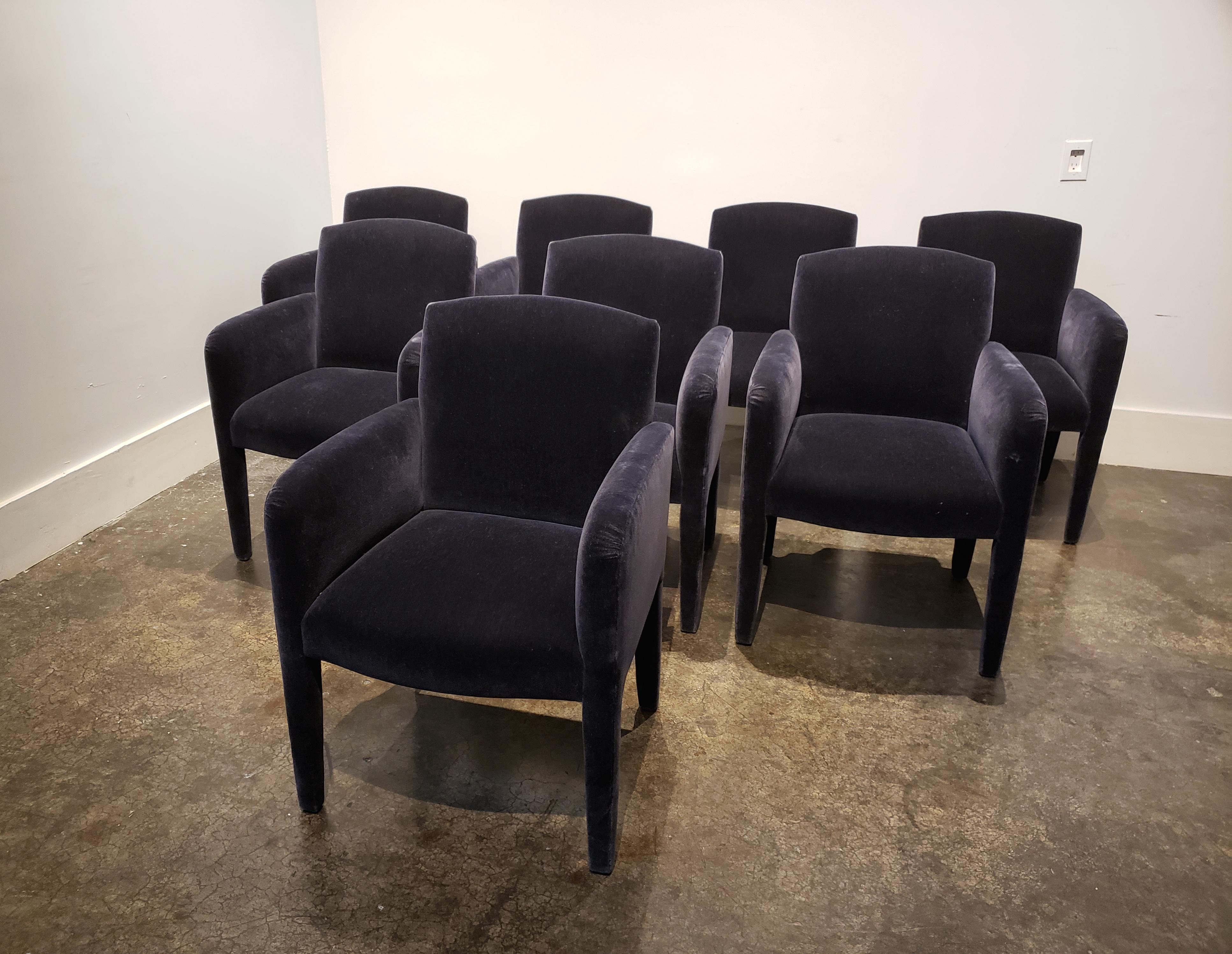 Modern design dining chairs fully upholstered in dark blue mohair manufactured by Donghia. In good condition with light wear to upholstery. Set of 8.

Each chair measures 24