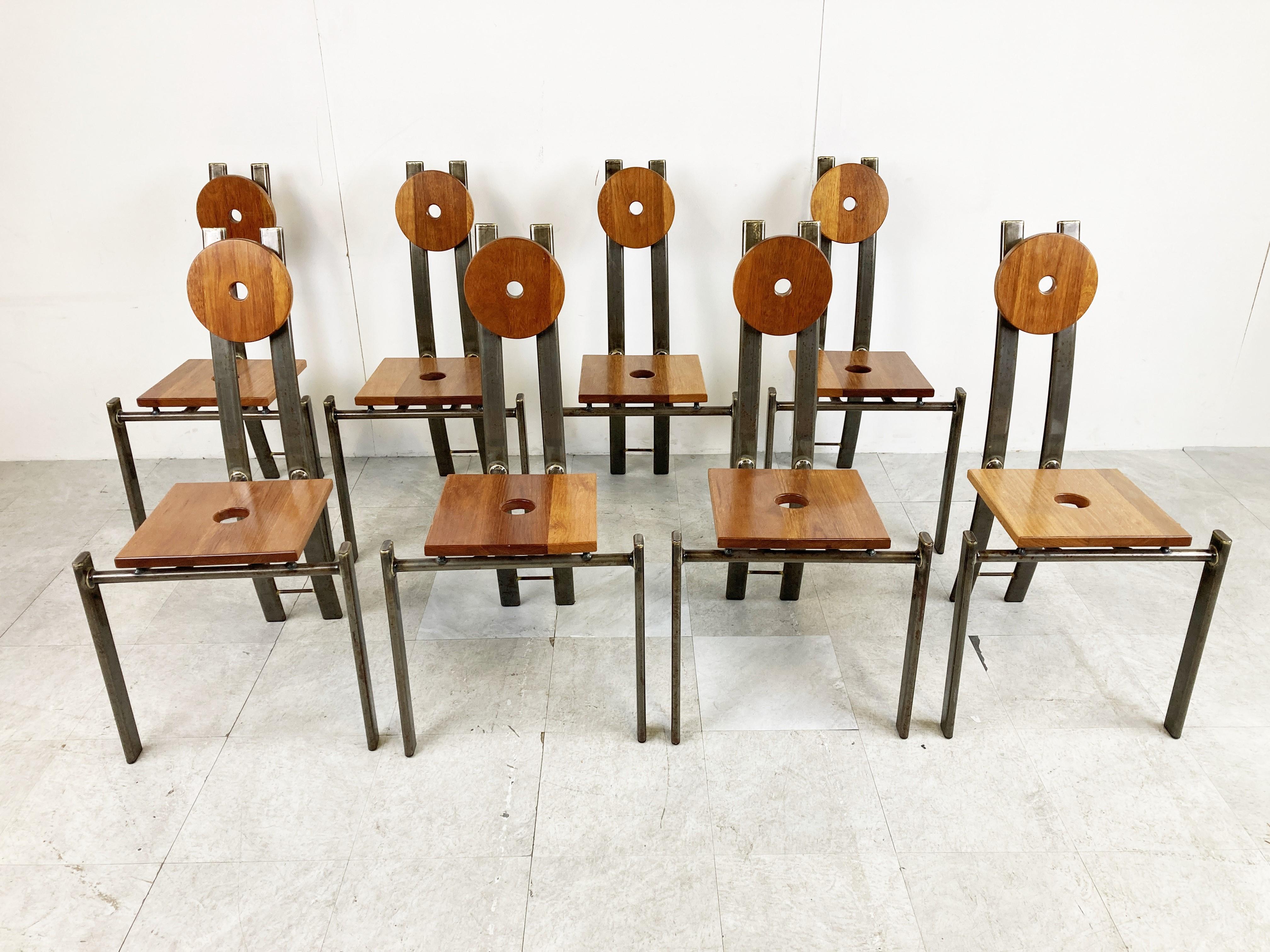 Set of 8 unique hand made brutalist dining chairs made from a metal frame with a square wooden seat and round wooden headrest.

You wont find a second set of these as they where custom made for a client in the seventies by local