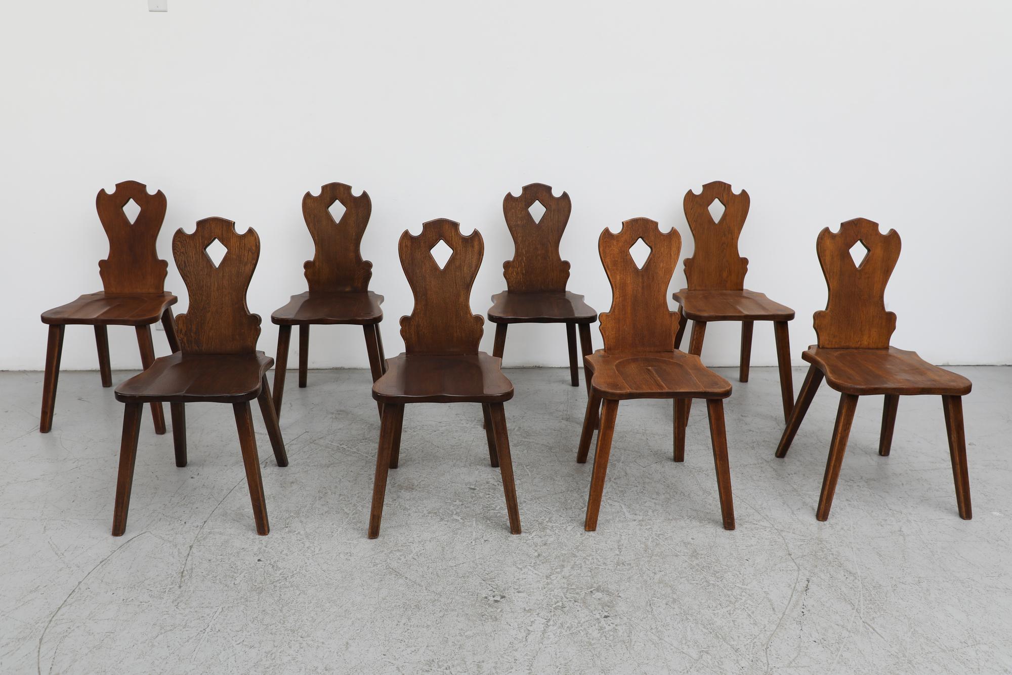Set of 6 Brutalist hand carved, beautifully organic solid wood chairs. Stylistically something of a marriage between Tyrolean style ornate carving and a more sleek mid century esthetic. This set is in mostly original condition with visible wear