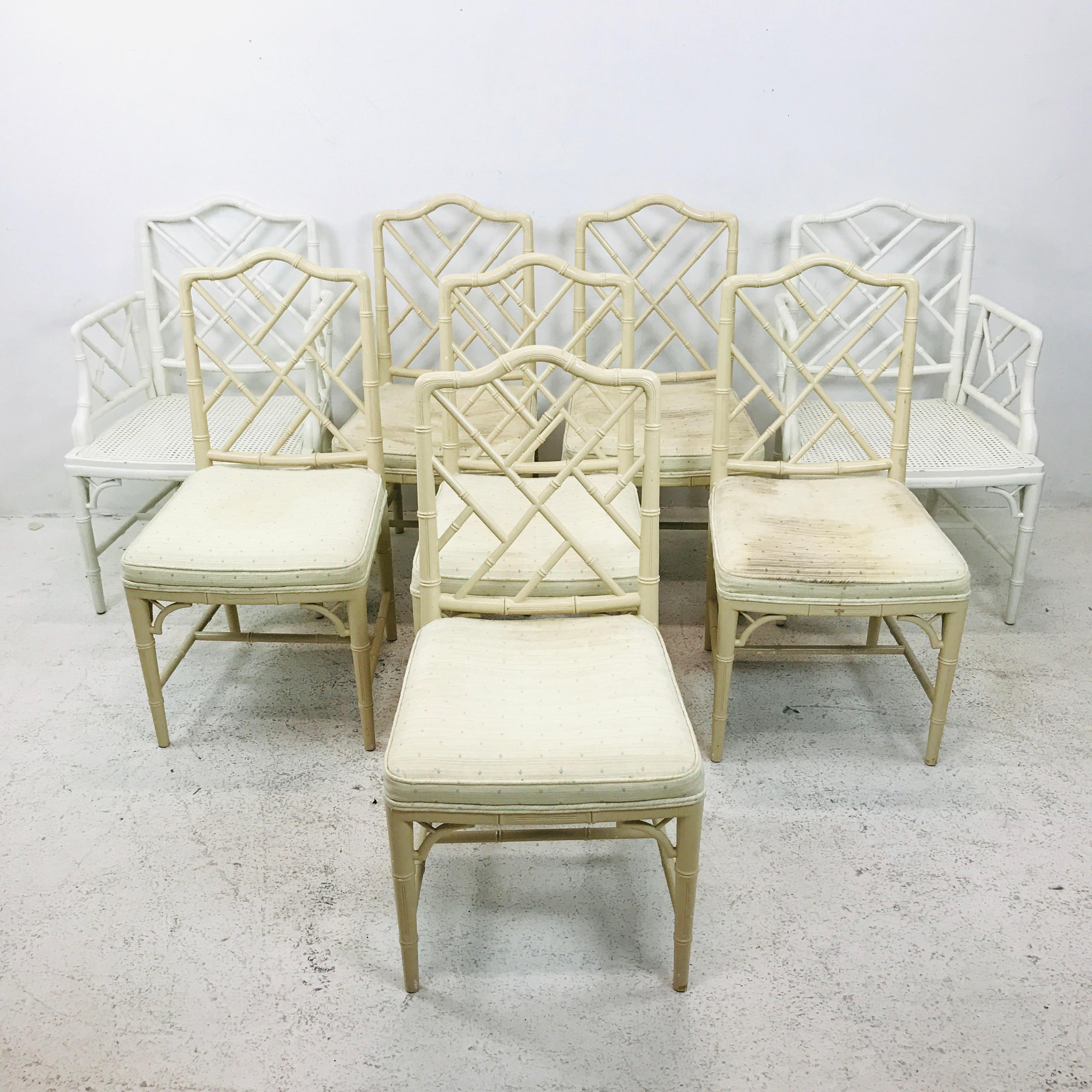 Set of eight faux bamboo Chinese Chippendale dining chairs (two armchairs and six side chairs), featuring trellis backs and arms and tapered legs. Armchairs have caned seats - reupholstery and refinishing is recommended on all. 
Measures: Side