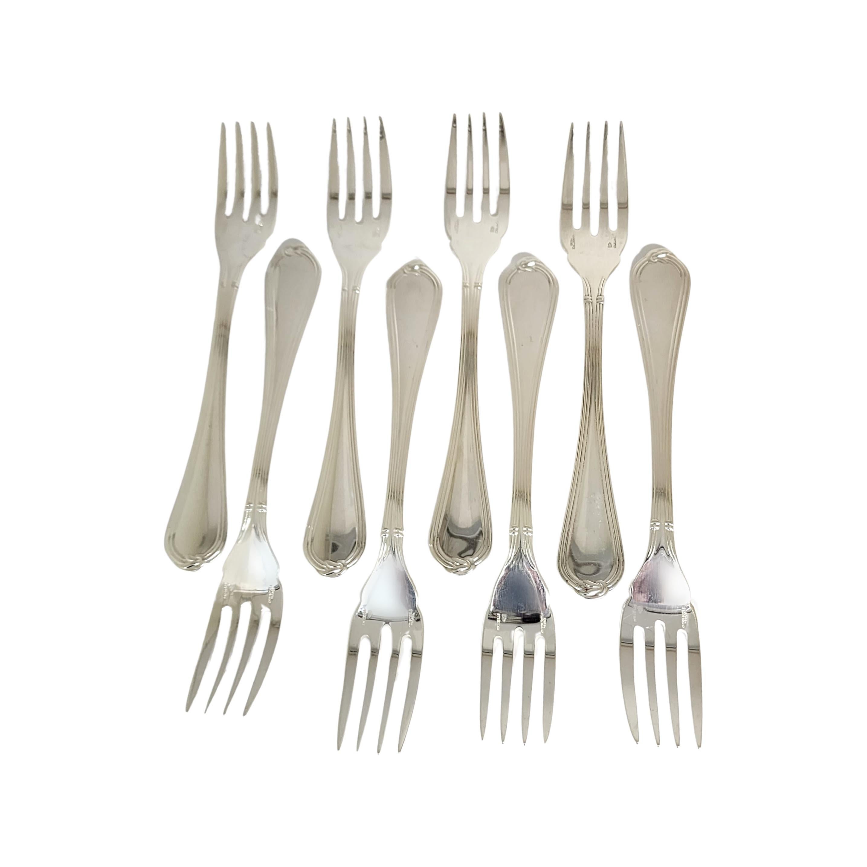 Set of 8 sterling silver salad/fish forks in the Oceana pattern by Christofle.

A beautiful set of forks in a simple and elegant pattern.

Measures approx 6 3/4