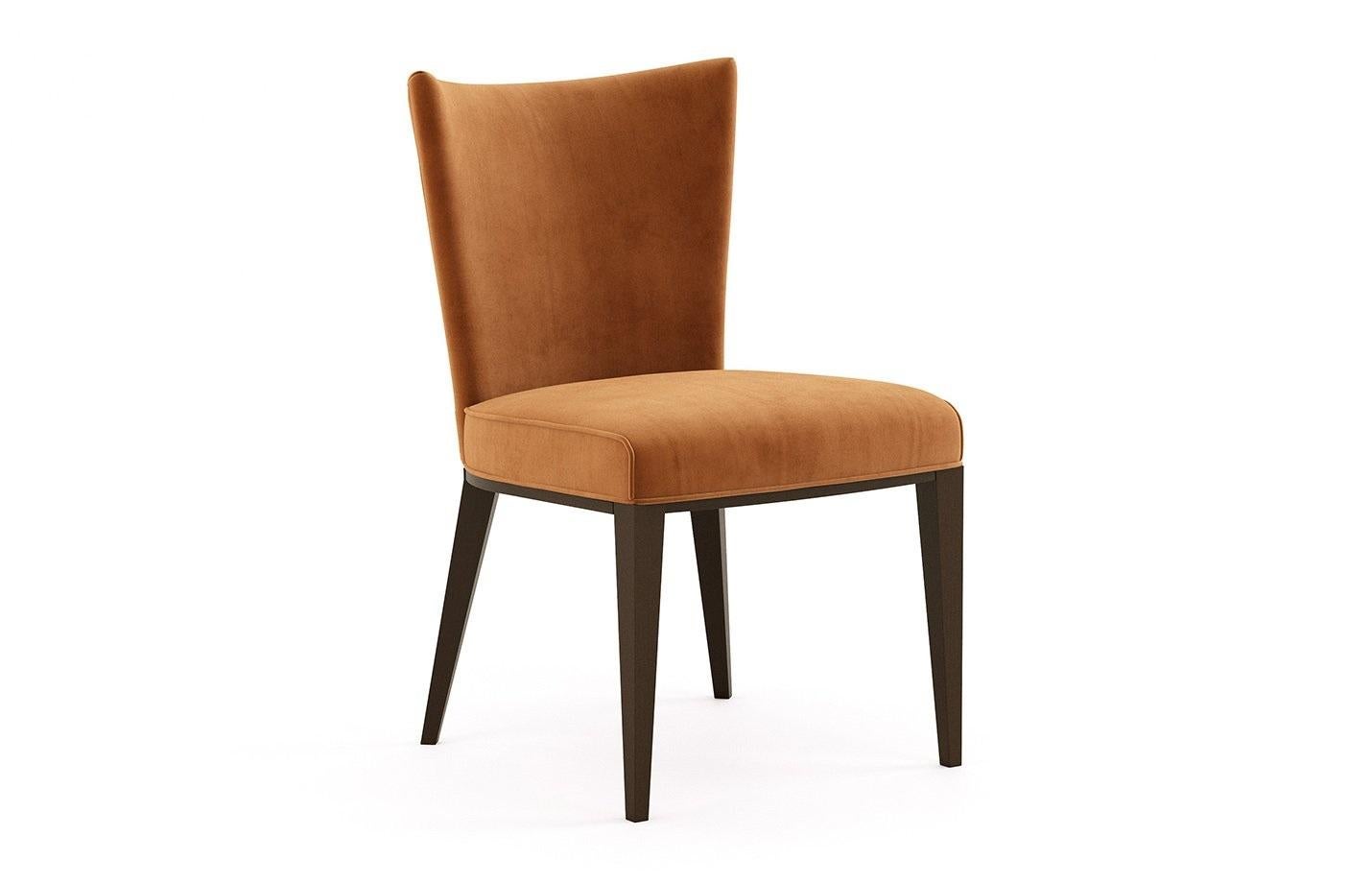 Timeless design in combination with handmade couture techniques. The dining chairs features curved wooden upholstered back for greater comfort. Offered in fumed Oak frame and brick velvet that is resistant to stains and abrasion.
Fabrics: Brick