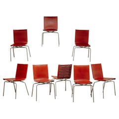 set of 8 crossed legs red leather chairs by Fabian Van Severen